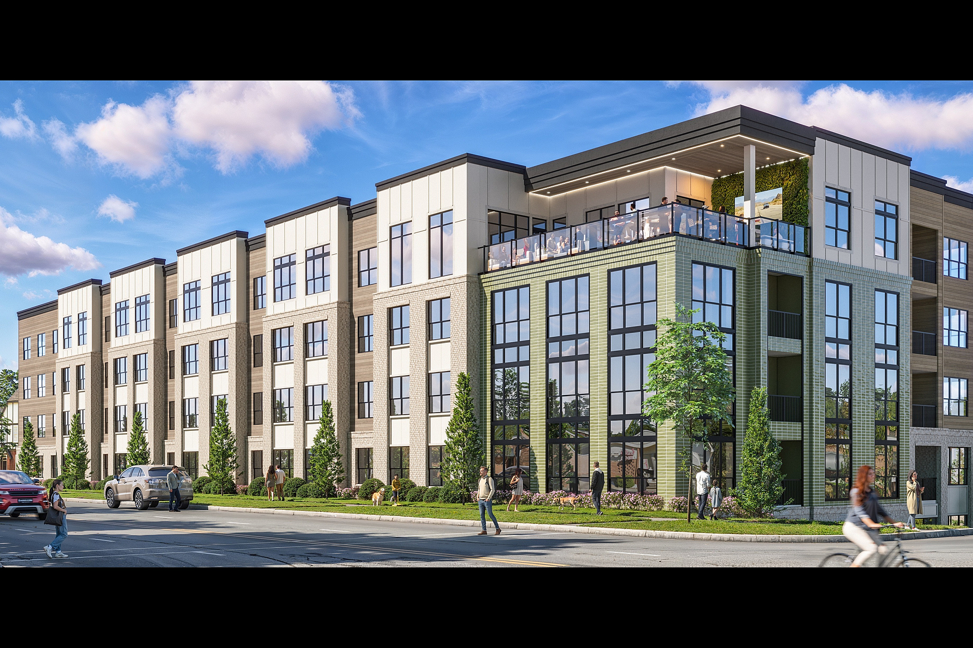 Modern apartment complex with expansive glass windows, lush landscaping, and a lively rooftop terrace.