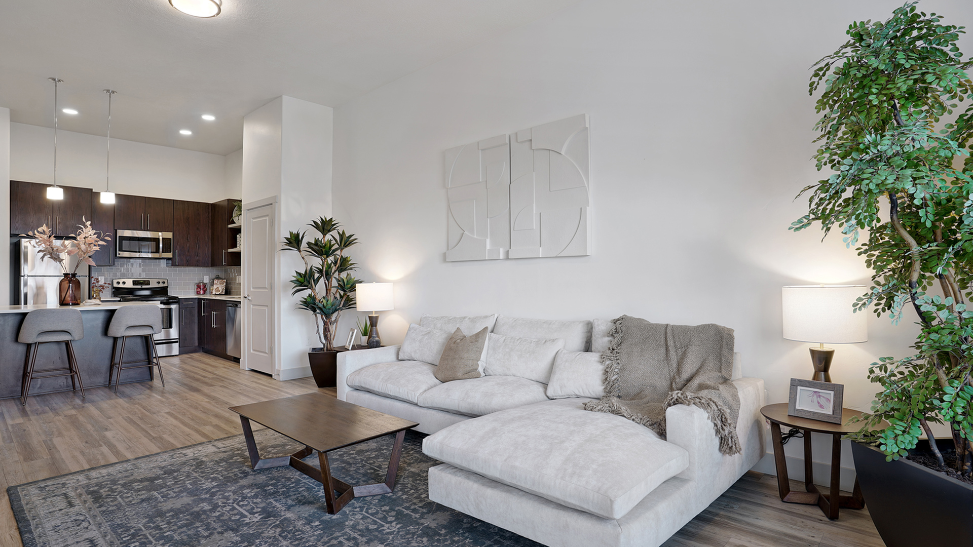 Spacious living room in a studio to 3-bedroom apartment at Parkway Lofts, featuring modern finishes and an open layout designed for comfort and style.