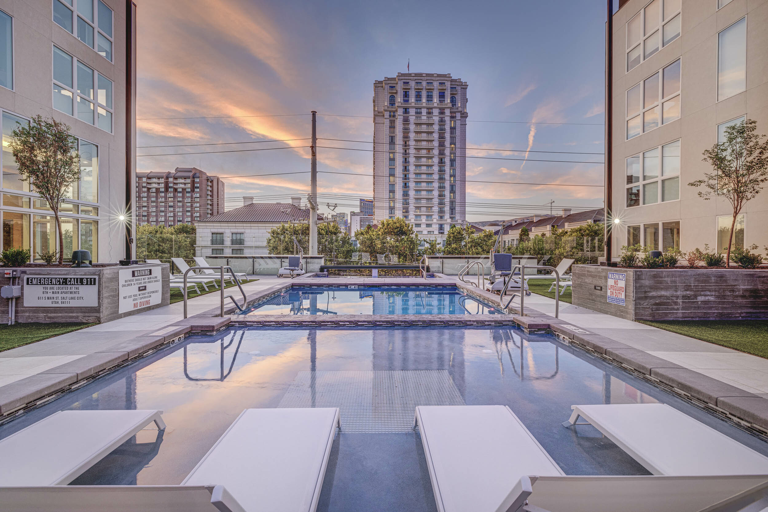 Resort-style rooftop pool at 6th & Main Apartments in downtown Salt Lake City featuring skyline views, lounge seating, and a relaxing outdoor atmosphere.