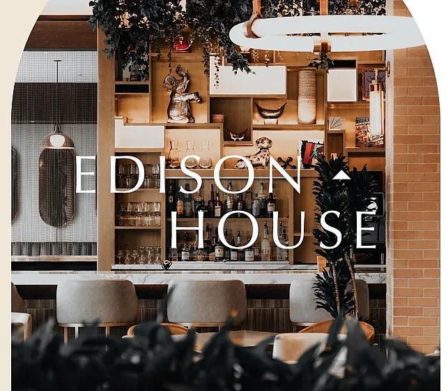 Interior of Edison House social club in Salt Lake City featuring bar and lounge, accessible to Silo Park residents through partnership