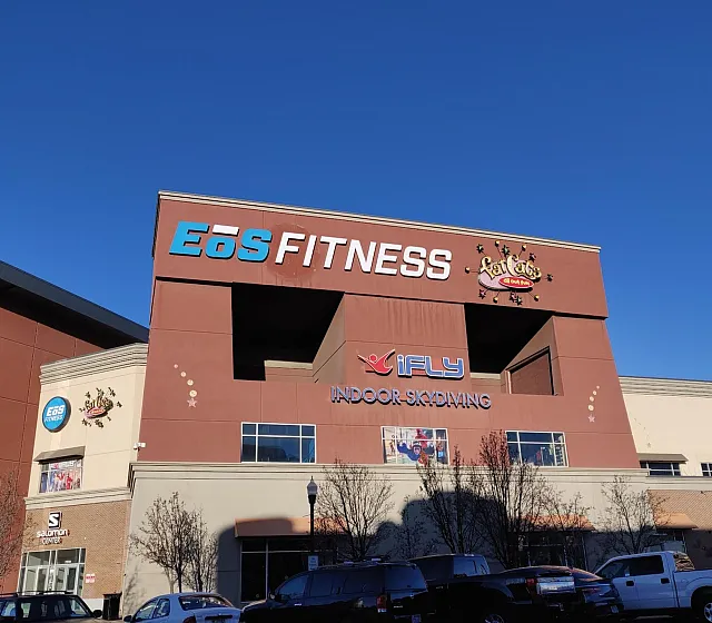 Exterior of EōS Fitness Ogden on Kiesel Ave next to Junction View apartments offering convenient walkable gym access