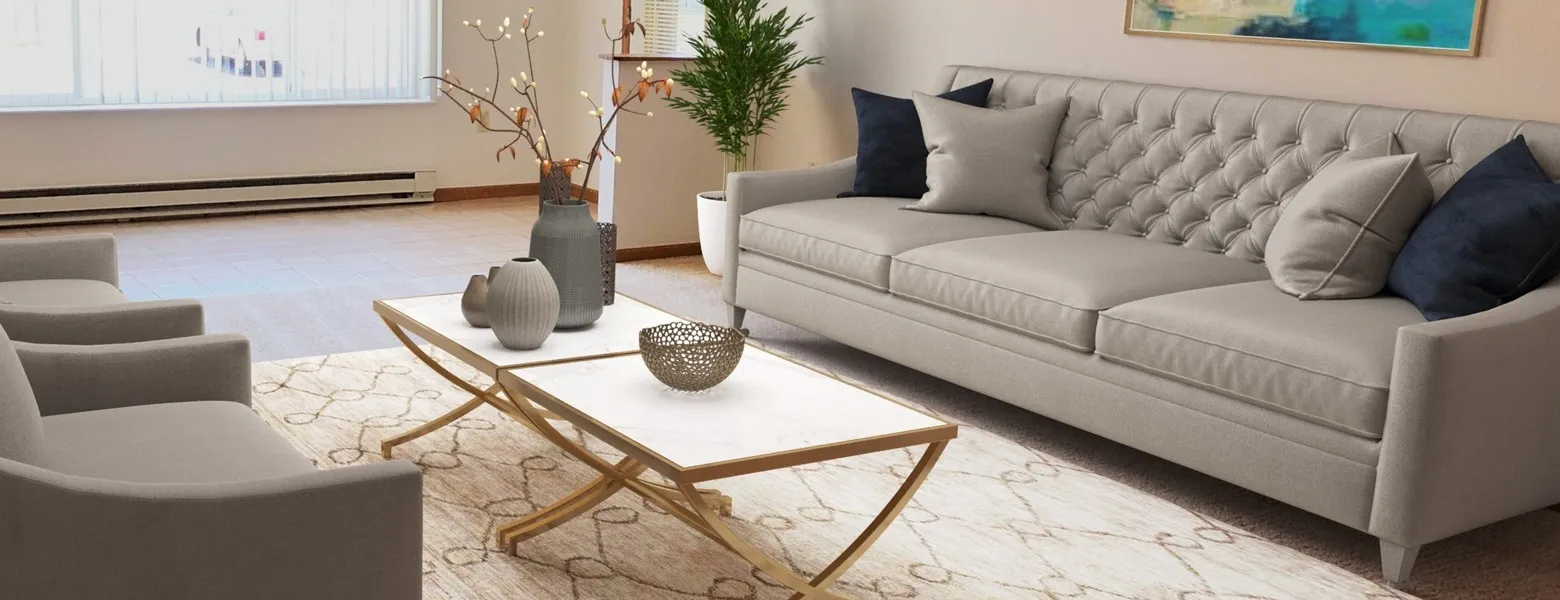 Living room with a couch along the right wall, coffee table in the middle, and along the right wall are two chairs. A large window is on the back wall.