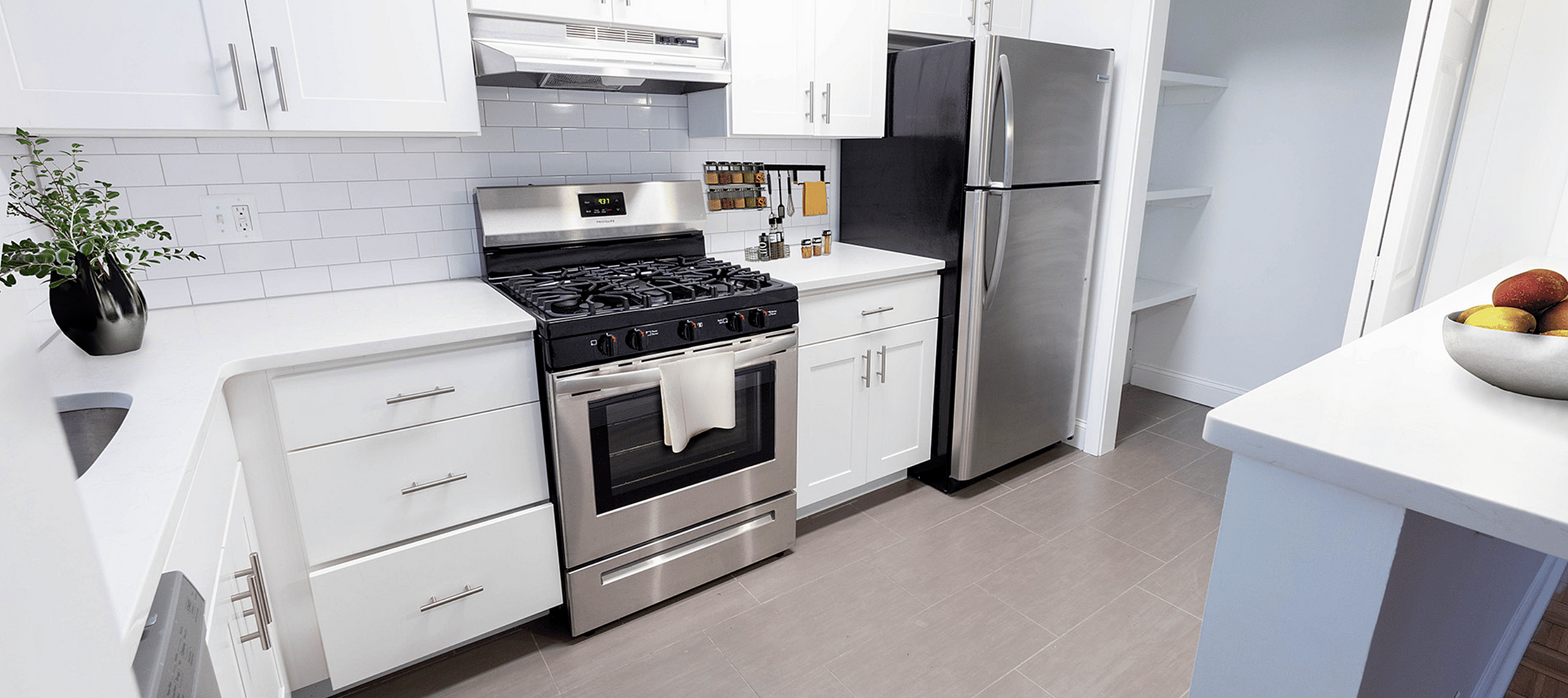 Modern kitchen with updated appliances and breakfast bar at Summit Park