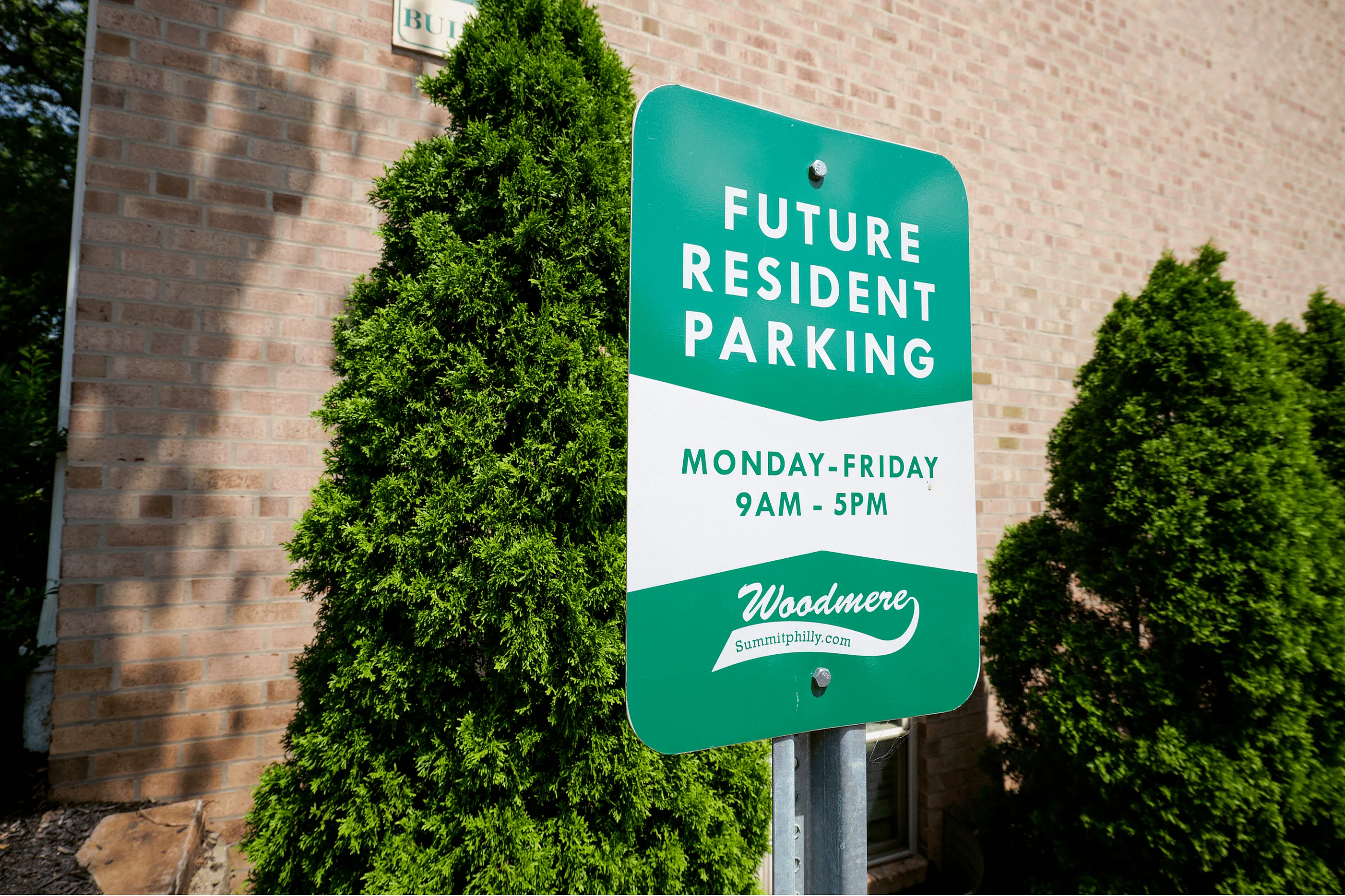 Sign for prospective residents at Woodmere Apartments in Roxborough