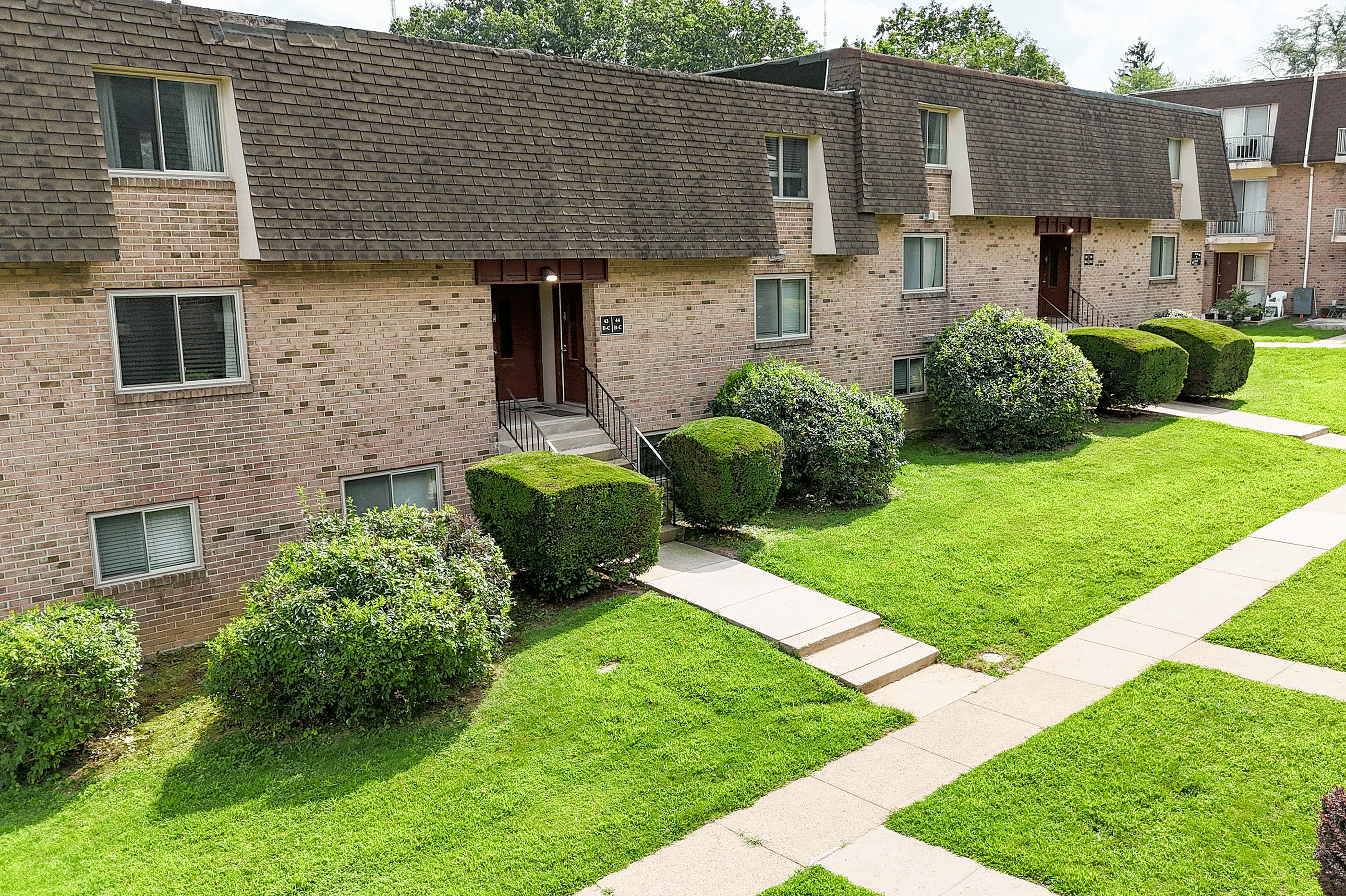 Lush landscaped grounds at Valley High Apartments, part of Summit Park Communities in Roxborough