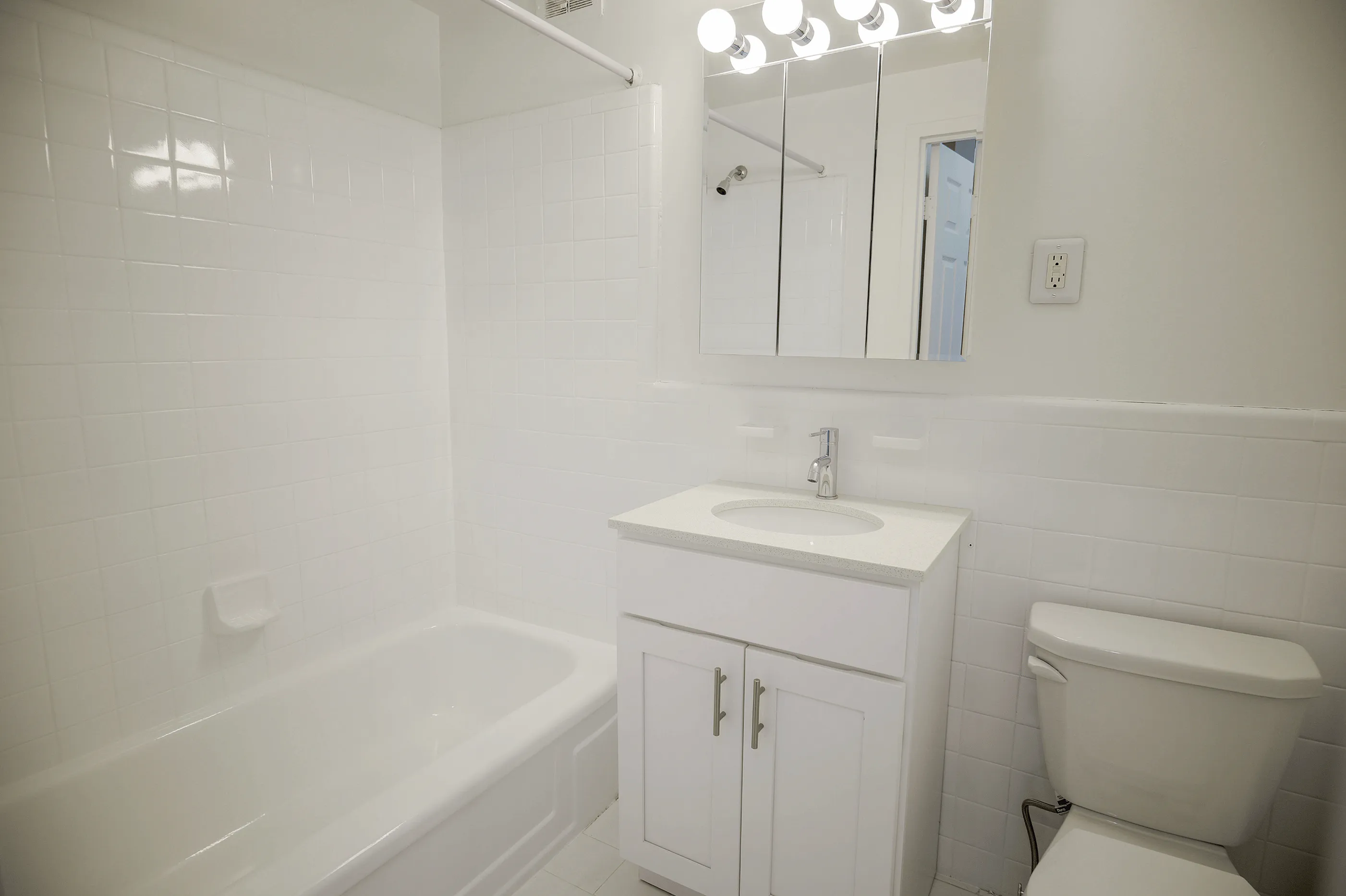 Renovated bathroom with sleek fixtures at Conwyn Arms Apartments in Bryn Mawr PA