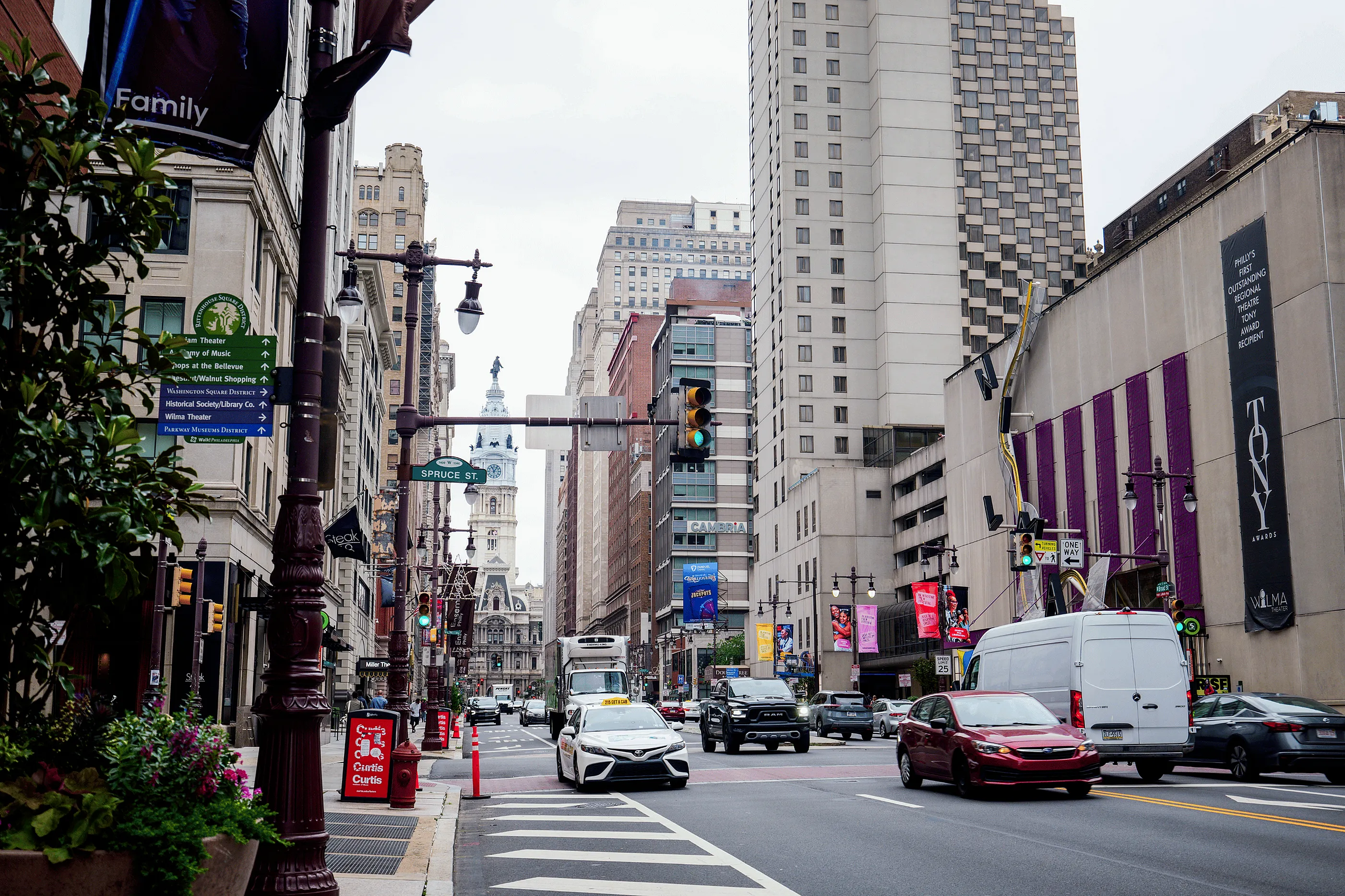 Vibrant urban cityscape with bustling street scene, tall buildings, and iconic architecture in background, ideal for city living.