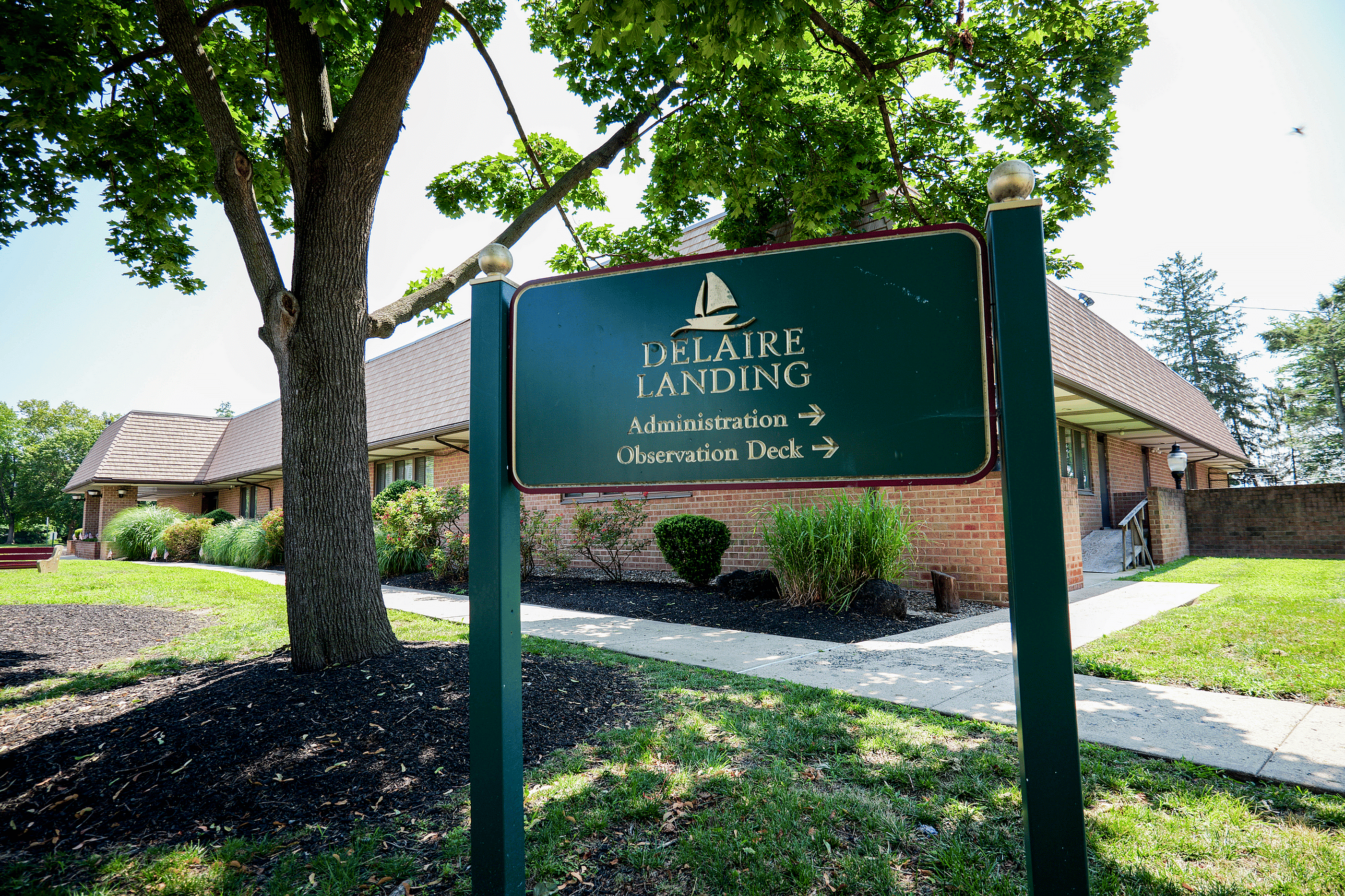 Charming view of Delaire Landing with lush landscaping and inviting pathways.