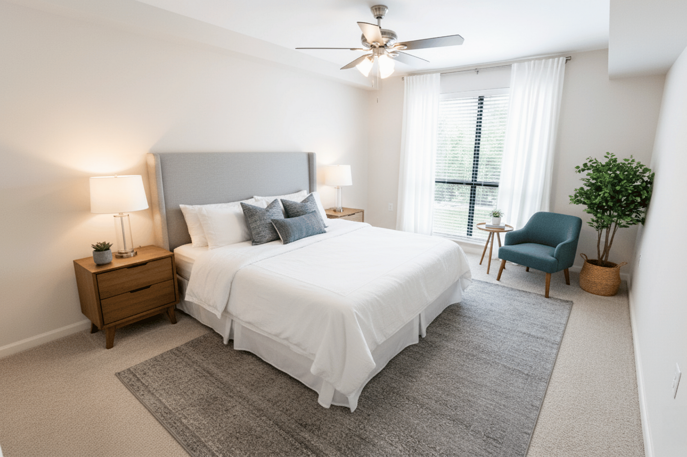 Bright and airy bedroom with modern decor, featuring a cozy bed, stylish side tables, and a large window for natural light.
