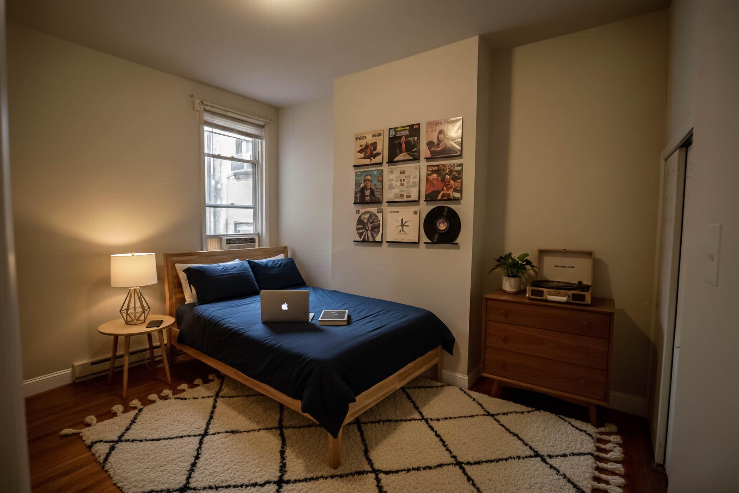 Cozy bedroom with a modern aesthetic, featuring a wooden bed, stylish decor, and inviting ambiance, perfect for relaxation.