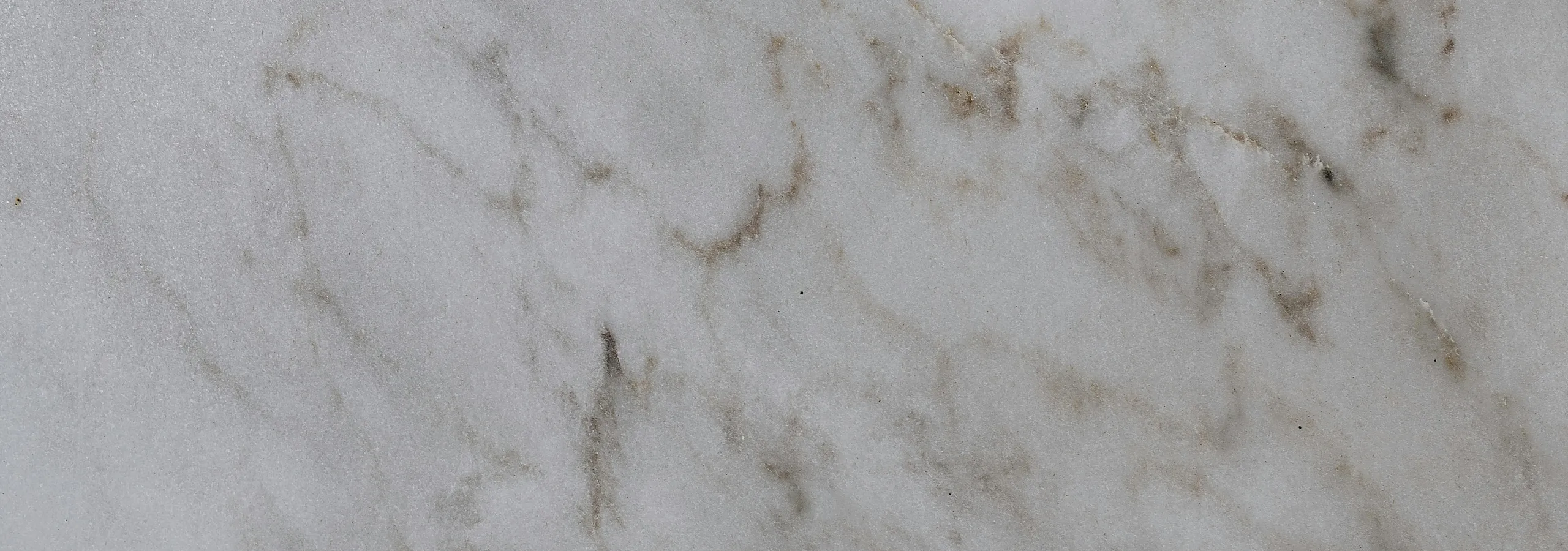 Elegant marble surface with subtle vein patterns, perfect for a luxurious home interior design.