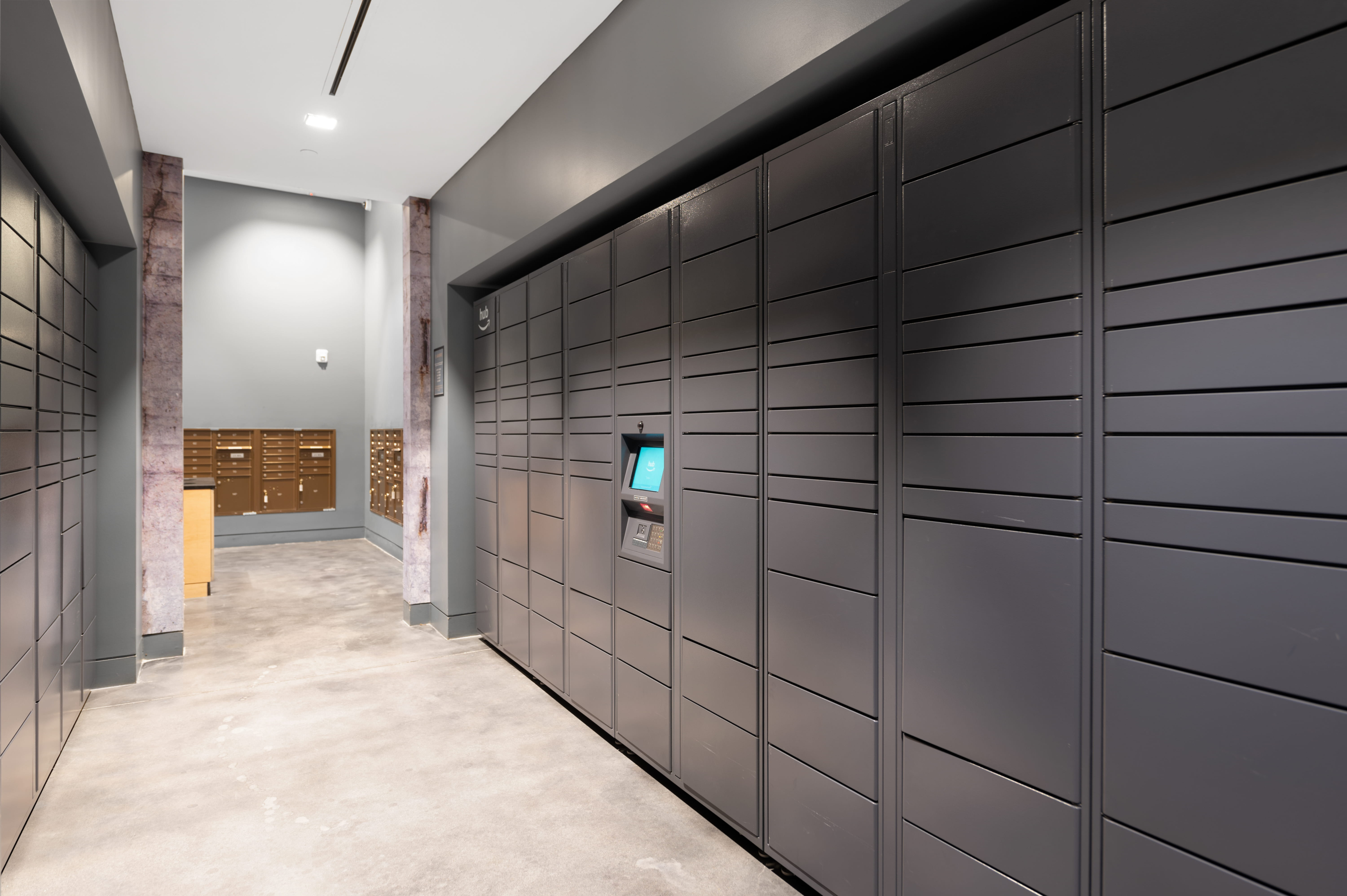 Modern package locker room featuring sleek black lockers and an inviting, well-lit atmosphere.