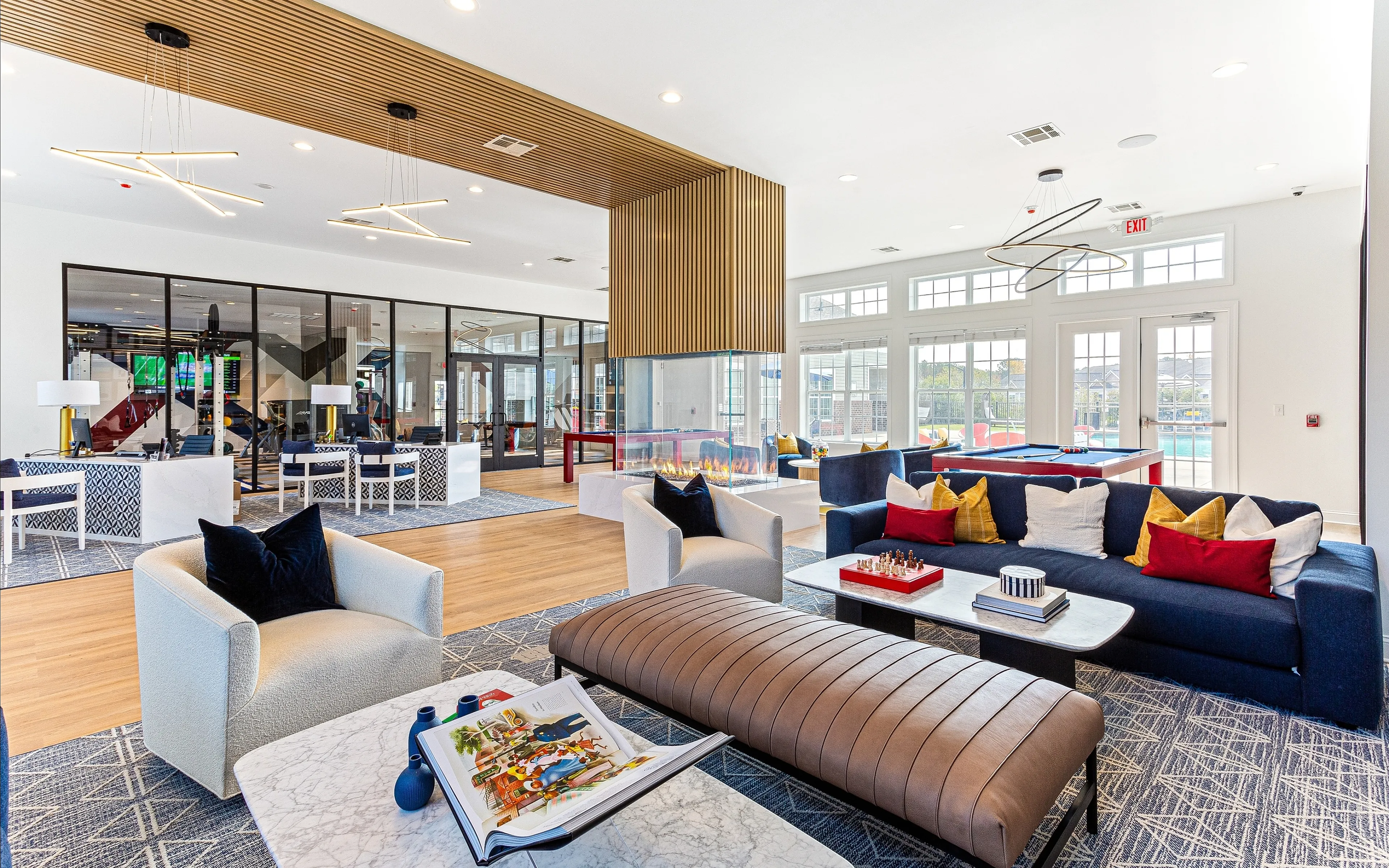 Sophisticated and spacious apartment lounge with modern furnishings, stylish decor, and natural light