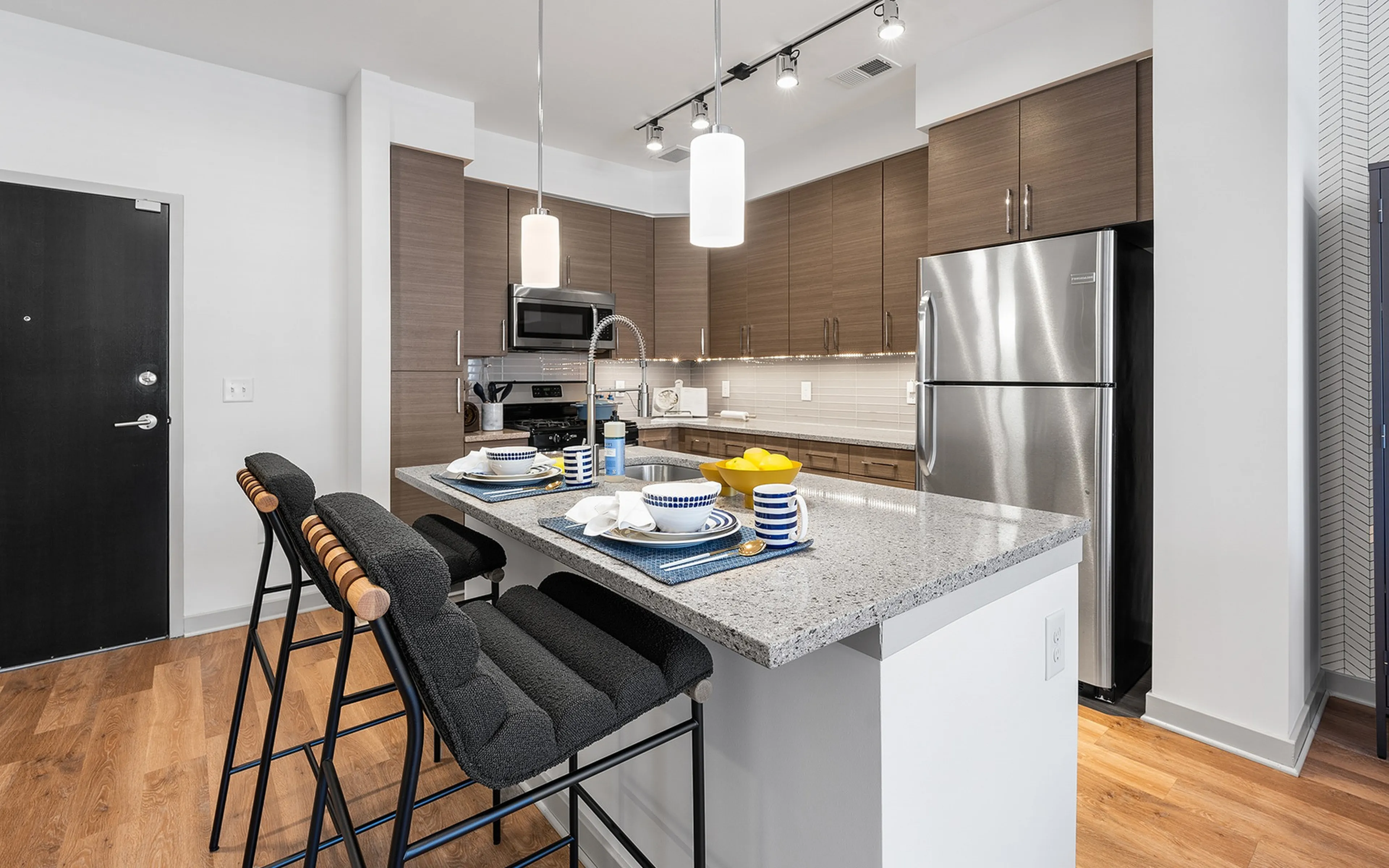 Contemporary kitchen with sleek cabinetry and stainless steel appliances.