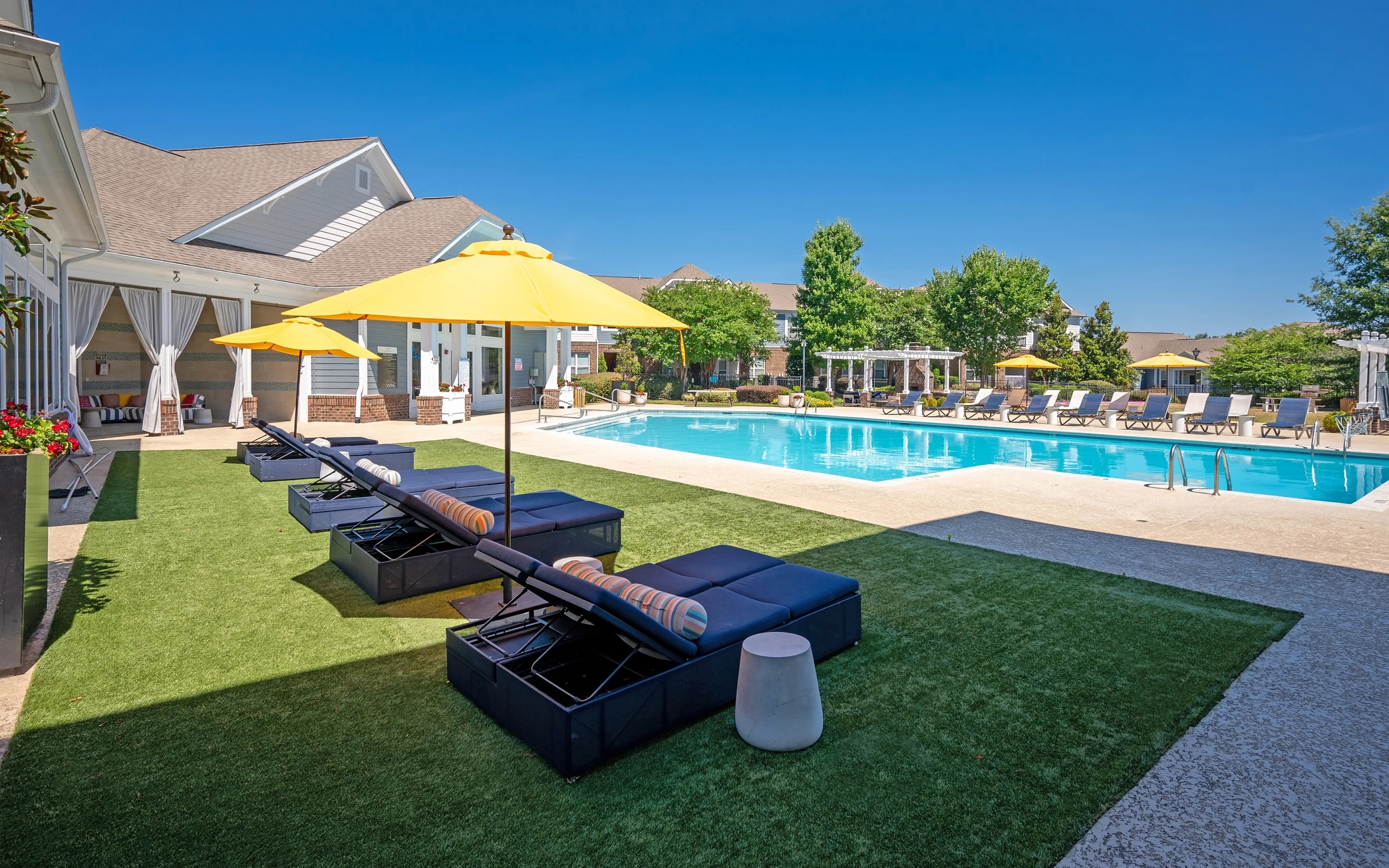 pool with blue lounge chairs