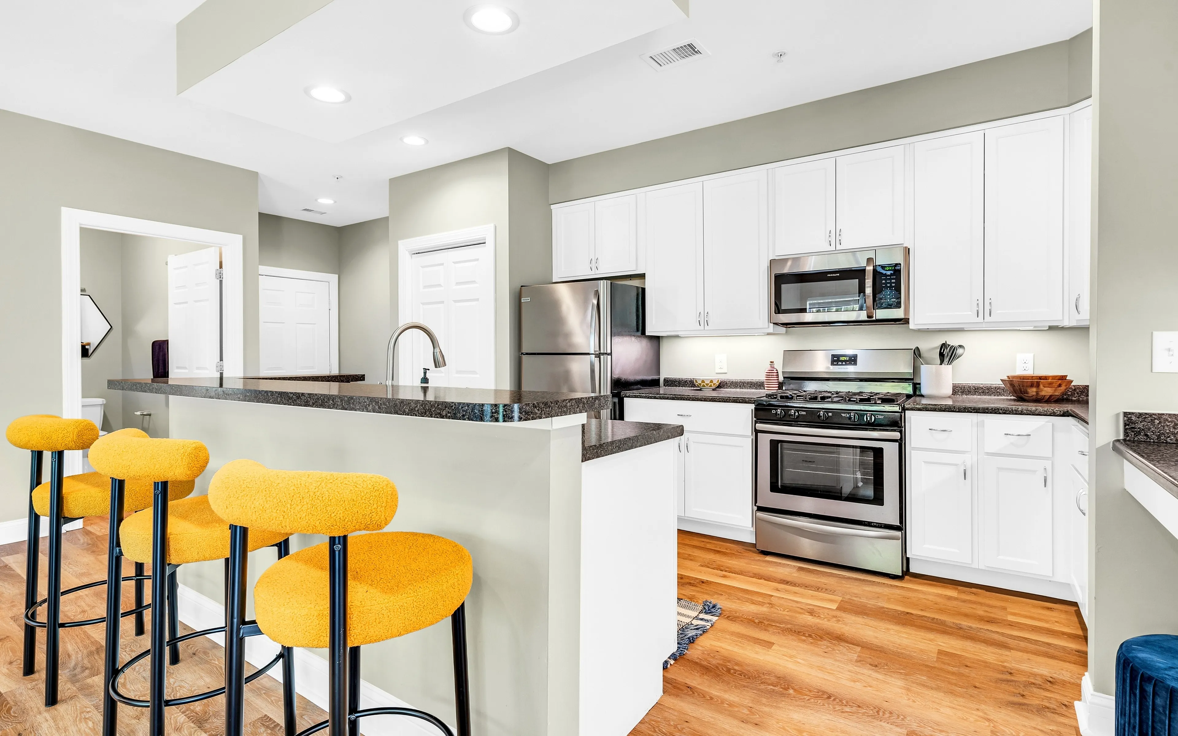 kitchen with yellow stools