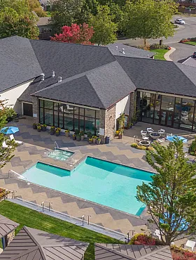drone photo of pool and clubhouse