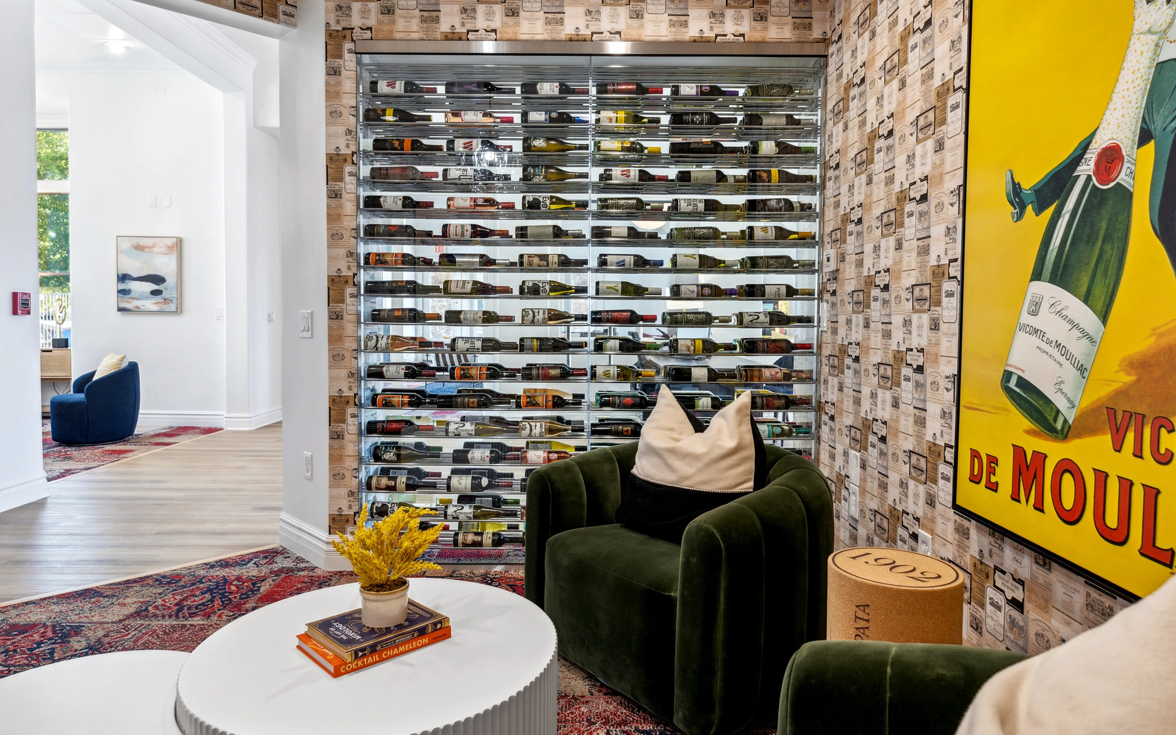 wine bottles in wine room and a green chair