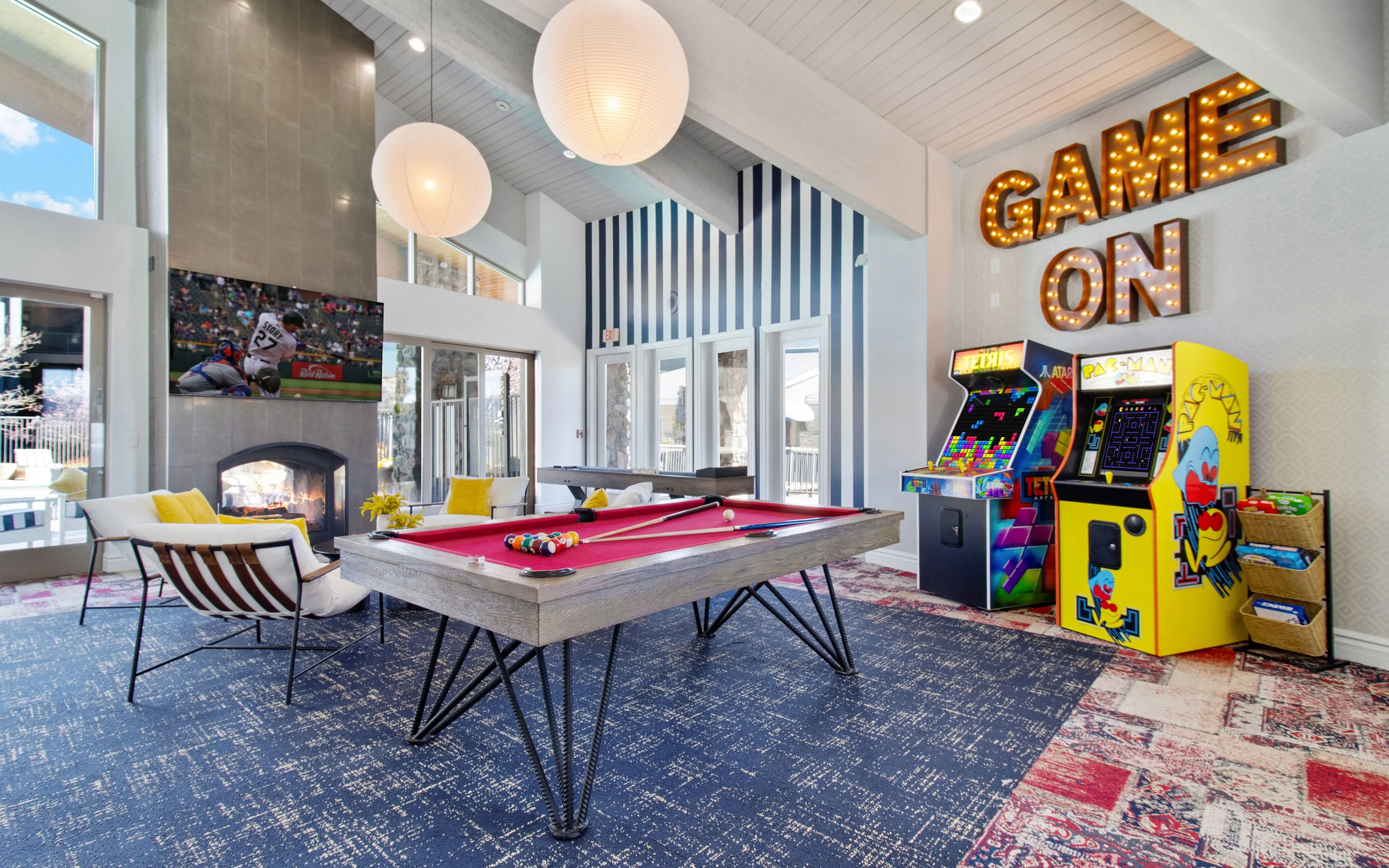 game room with billiards and arcade games