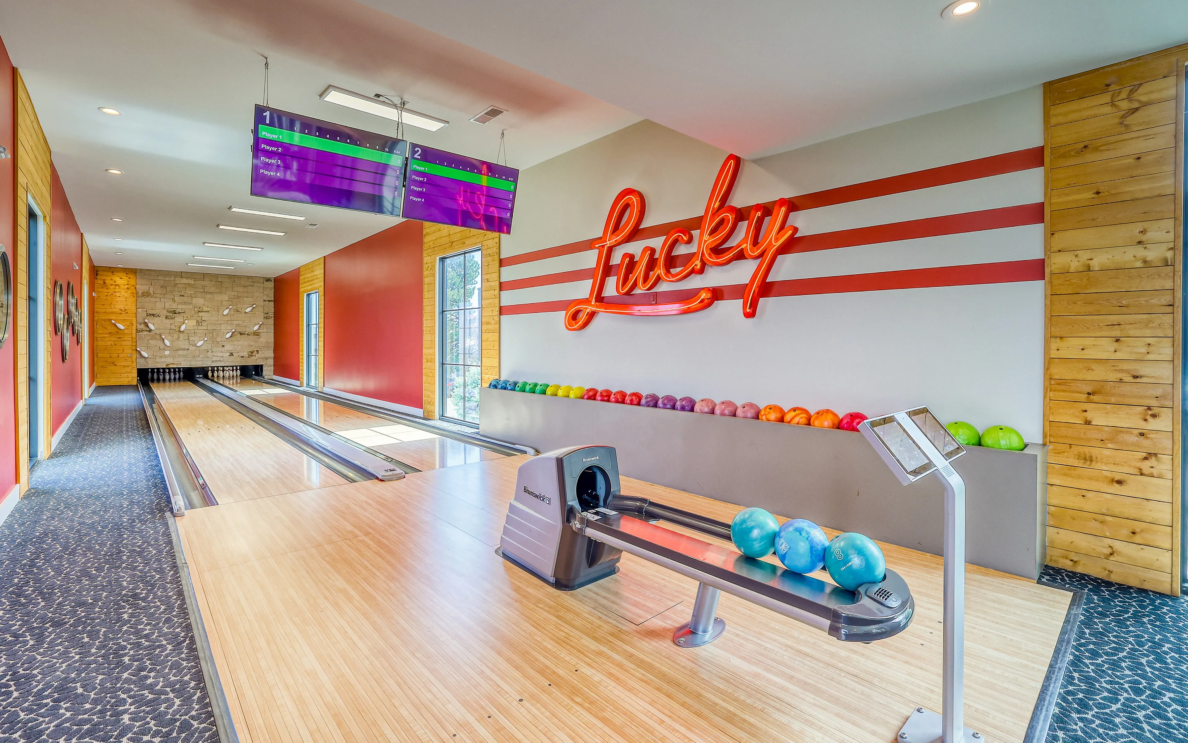 bowling alley with red neon lucky sign