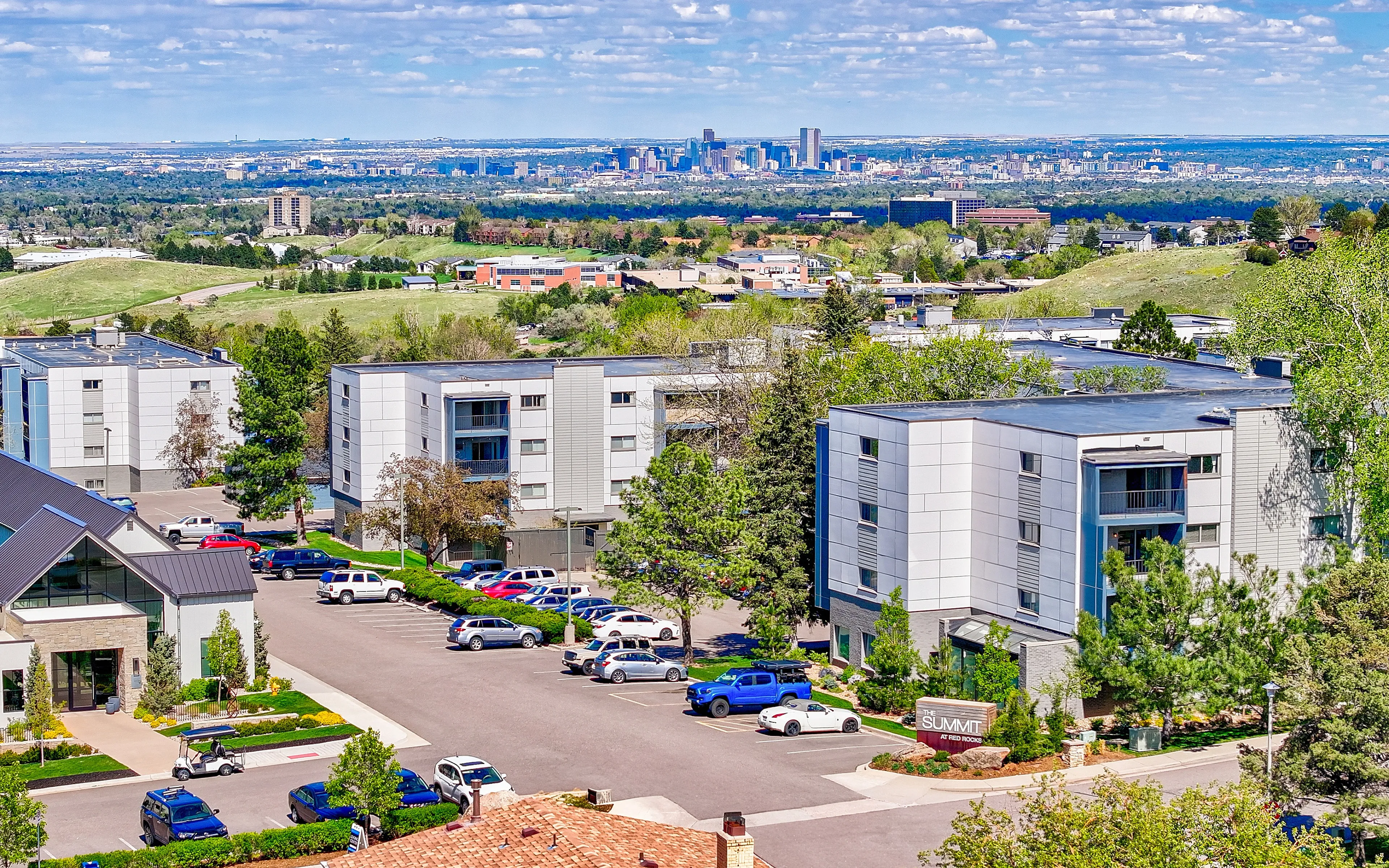 building exterior with downtown denver in background