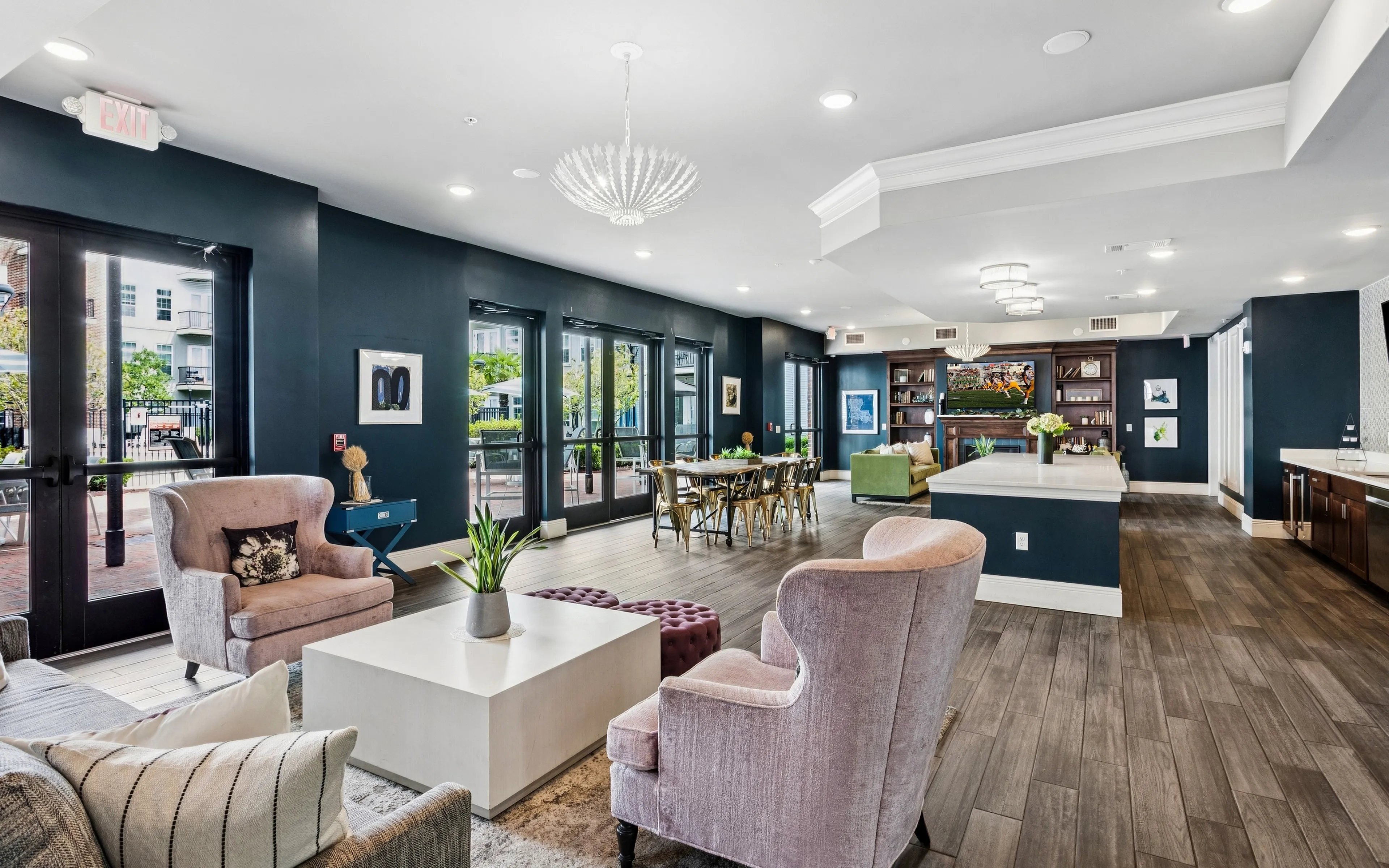 Elegant, modern living area with plush seating, chic lighting, expansive windows, and stylish decor, perfect for entertaining.