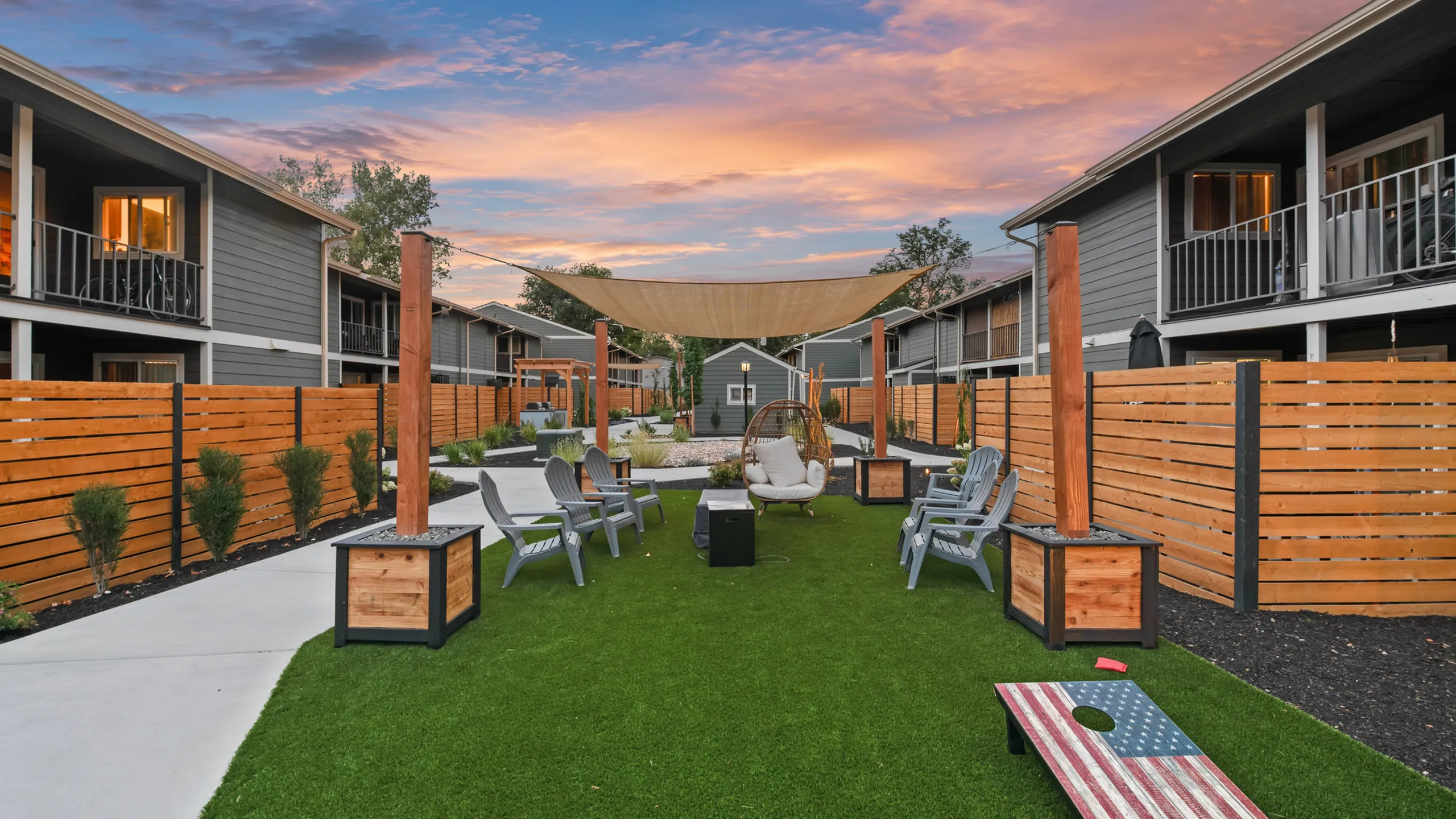 Charming courtyard view with stylish outdoor seating and lush greenery, perfect for relaxation and entertaining.
