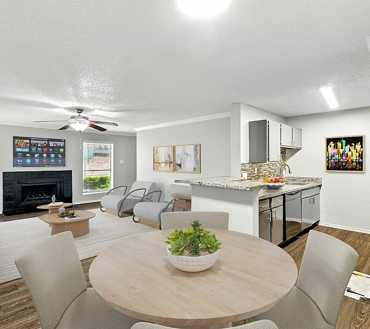 Charming open-plan living space featuring cozy seating, modern kitchen with stainless steel appliances, and stylish decor.