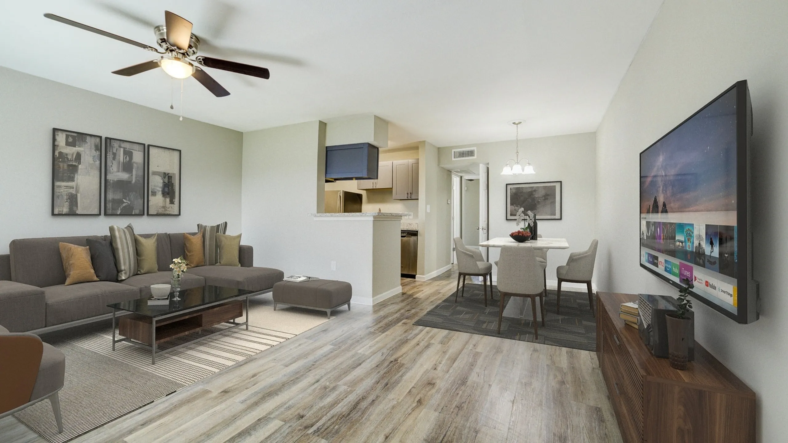 Modern living room with sleek wooden flooring, stylish sectional sofa, and elegant dining area, ideal for entertaining.