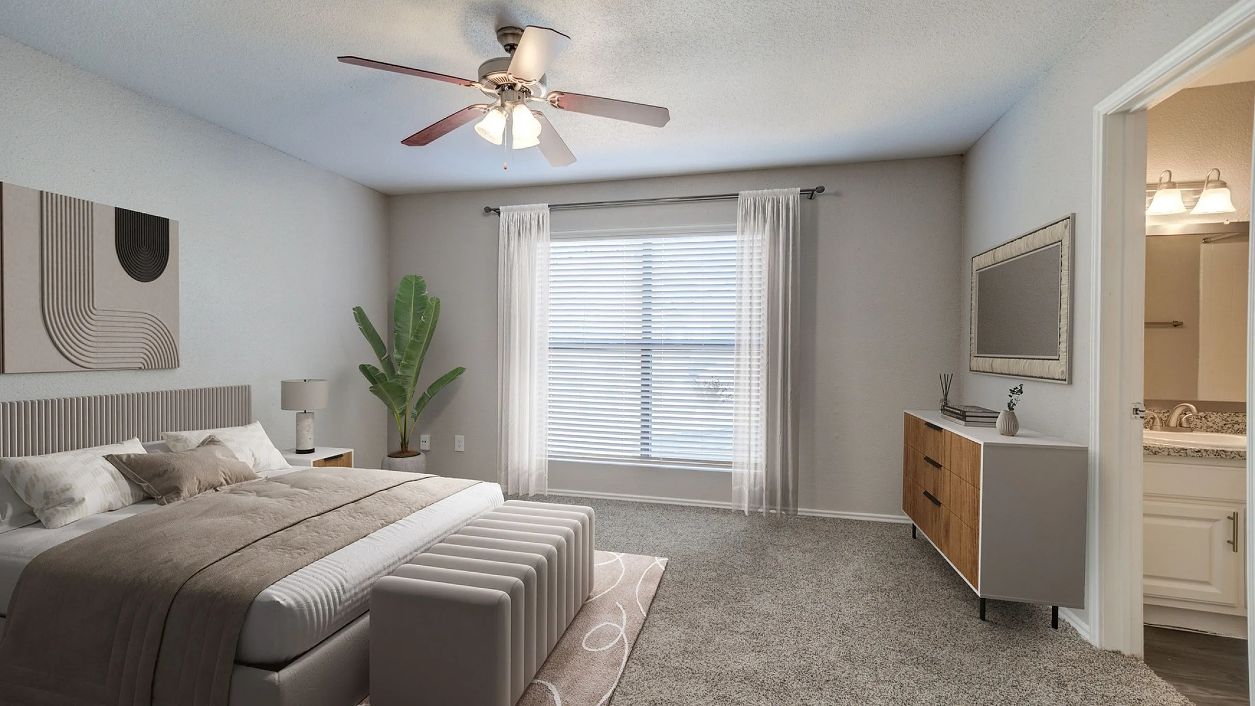 Elegant bedroom featuring a contemporary design with plush carpet, ceiling fan, and abundant natural light from a large window, seamlessly connected to a modern en-suite bathroom.