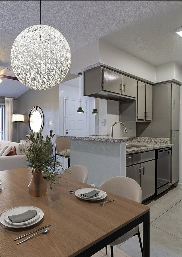 Chic apartment interior showcasing an open-concept living and dining area with elegant decor, modern kitchen, and abundant natural light.