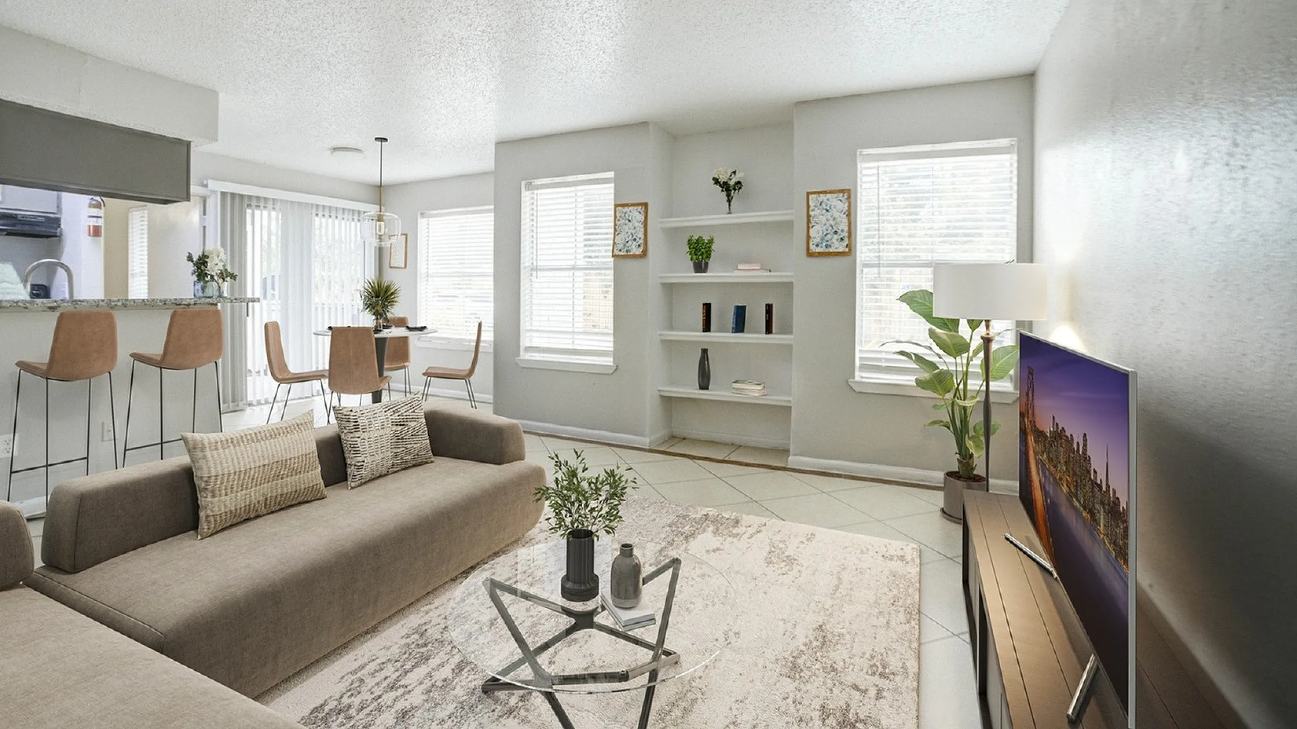 Bright and modern living room with plush seating, a sleek coffee table, and a wall-mounted TV. Open-concept space features a stylish breakfast bar, contemporary decor, and abundant natural light.