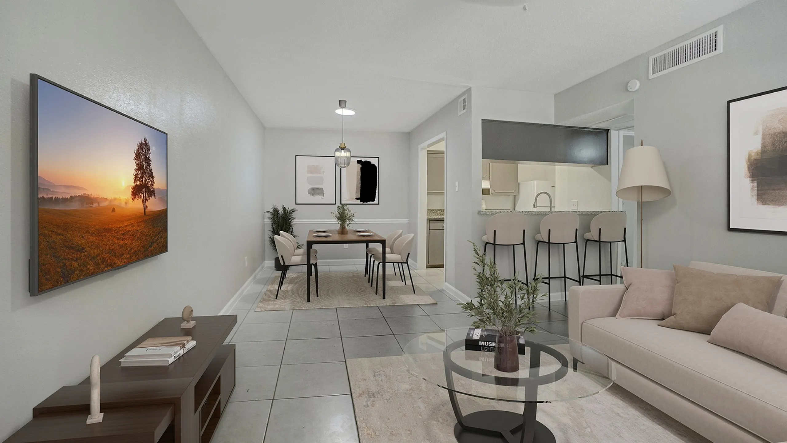 Chic open-plan living room and dining area with modern decor, comfy seating, and bright kitchen bar.