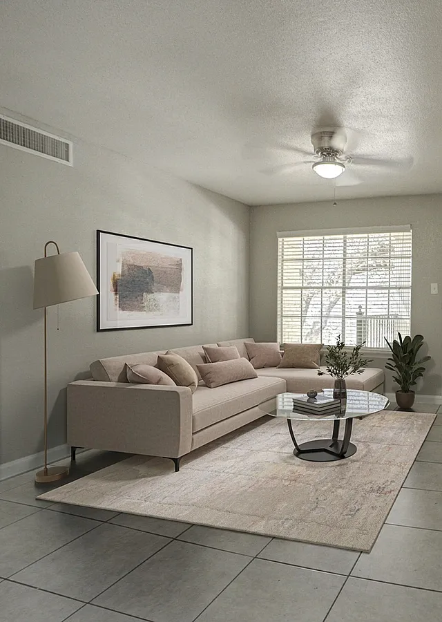 Bright and inviting living room with a cozy L-shaped sofa, modern decor, and natural light streaming through large windows.