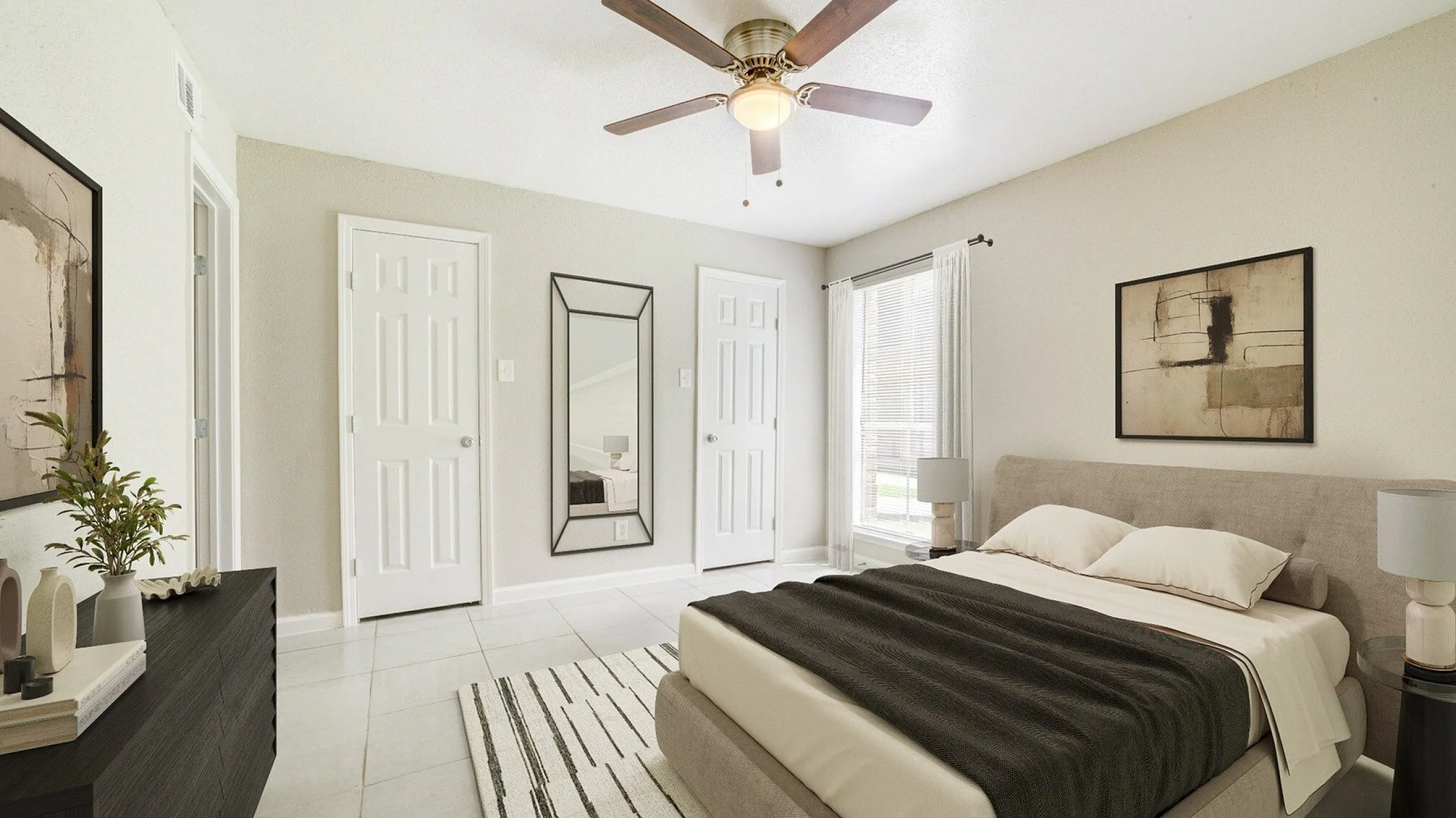 Elegant bedroom with neutral d&eacute;cor, featuring a plush bed, modern artwork, and a sunlit window with sheer curtains.