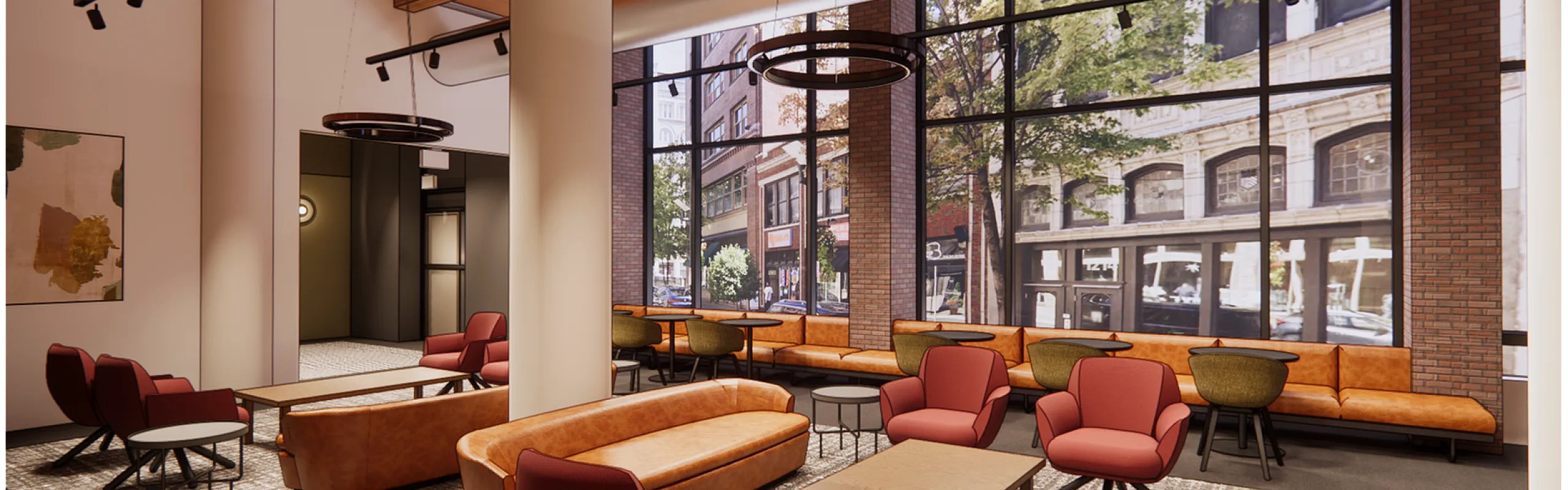 Chic urban lounge with stylish seating and floor-to-ceiling windows overlooking a vibrant street scene.