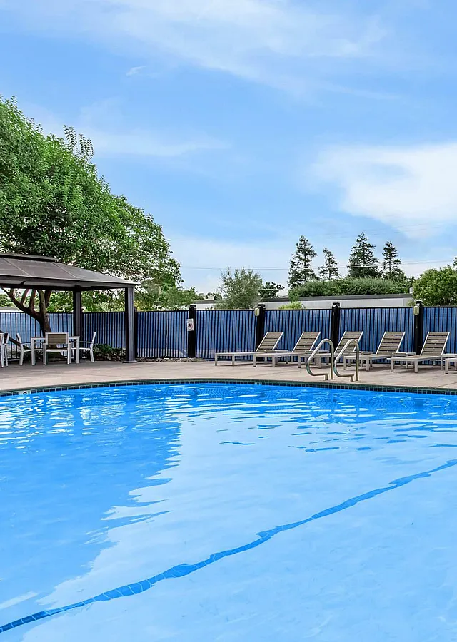 Fairway Village Apartments Swimming Pool with Cabana and Lounge Chairs