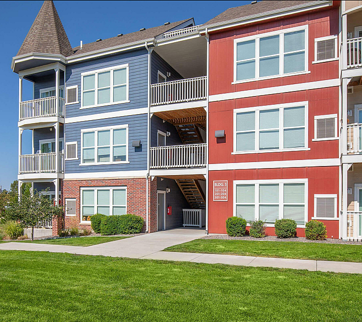 Parker Flats at Old Town Apartments Building Exterior Victorian Design Red and Blue