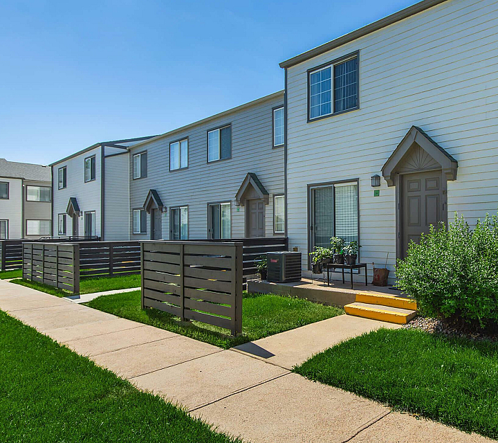 Briar Grove Townhomes Building Exterior with Private Entrances and Patios