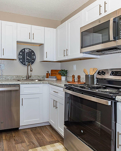 Briar Grove Townhomes Model Kitchen with White Shaker Cabinetry and Stainless Steel Appliances
