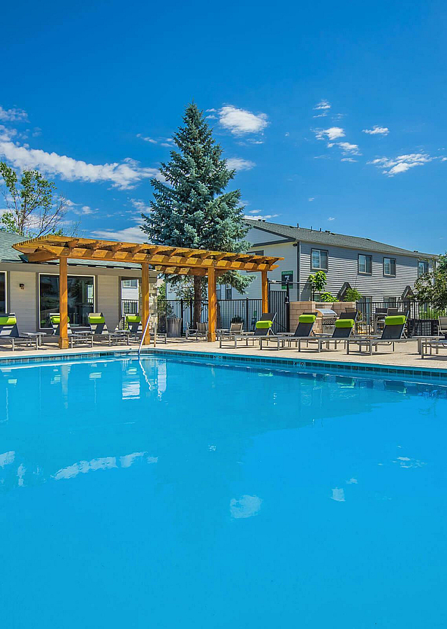 Briar Grove Townhomes Swimming Pool with Trellis and Lounge Chairs