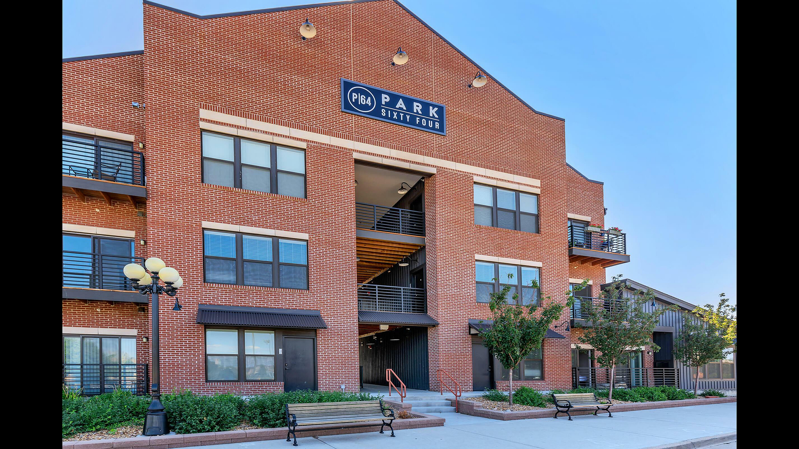 Park Sixty Four Apartments Red Brick Building Exterior with Panel Sign, Private Balconies