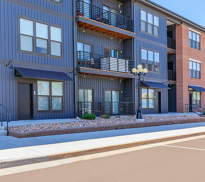 Park Sixty Four Apartments Building Exterior with Black Hardy Plank and Brick, Private Balconies and Patios