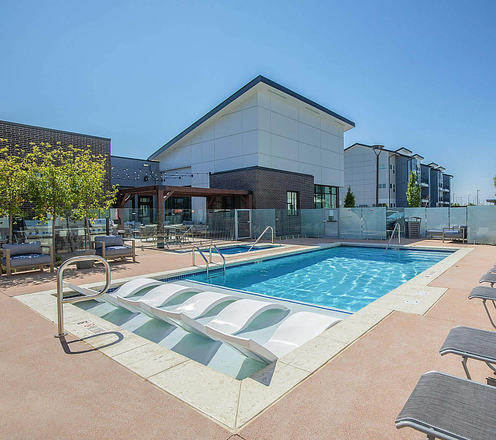 Pr&oacute;ximo at Pe&ntilde;a Station Apartments Swimming Pool with Social Space and Loungers