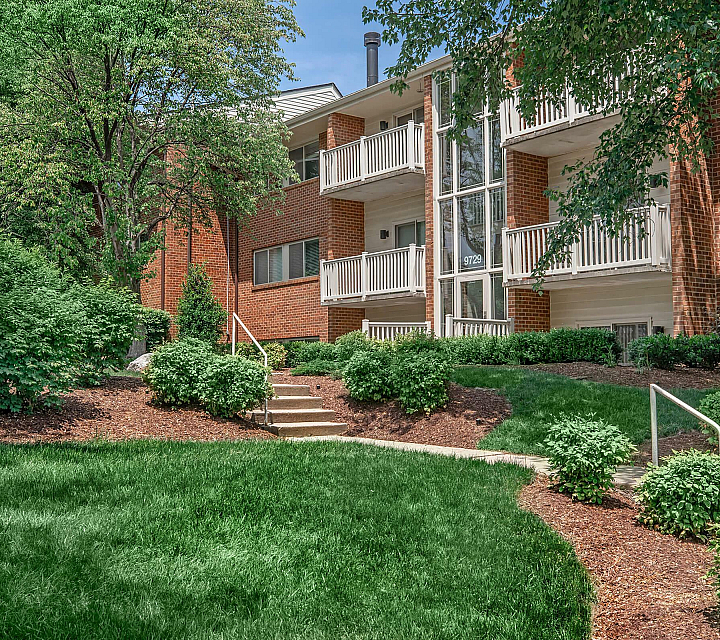 Huntington Square Building Exterior with Enclosed Glass Entrances and Lush Landscaping