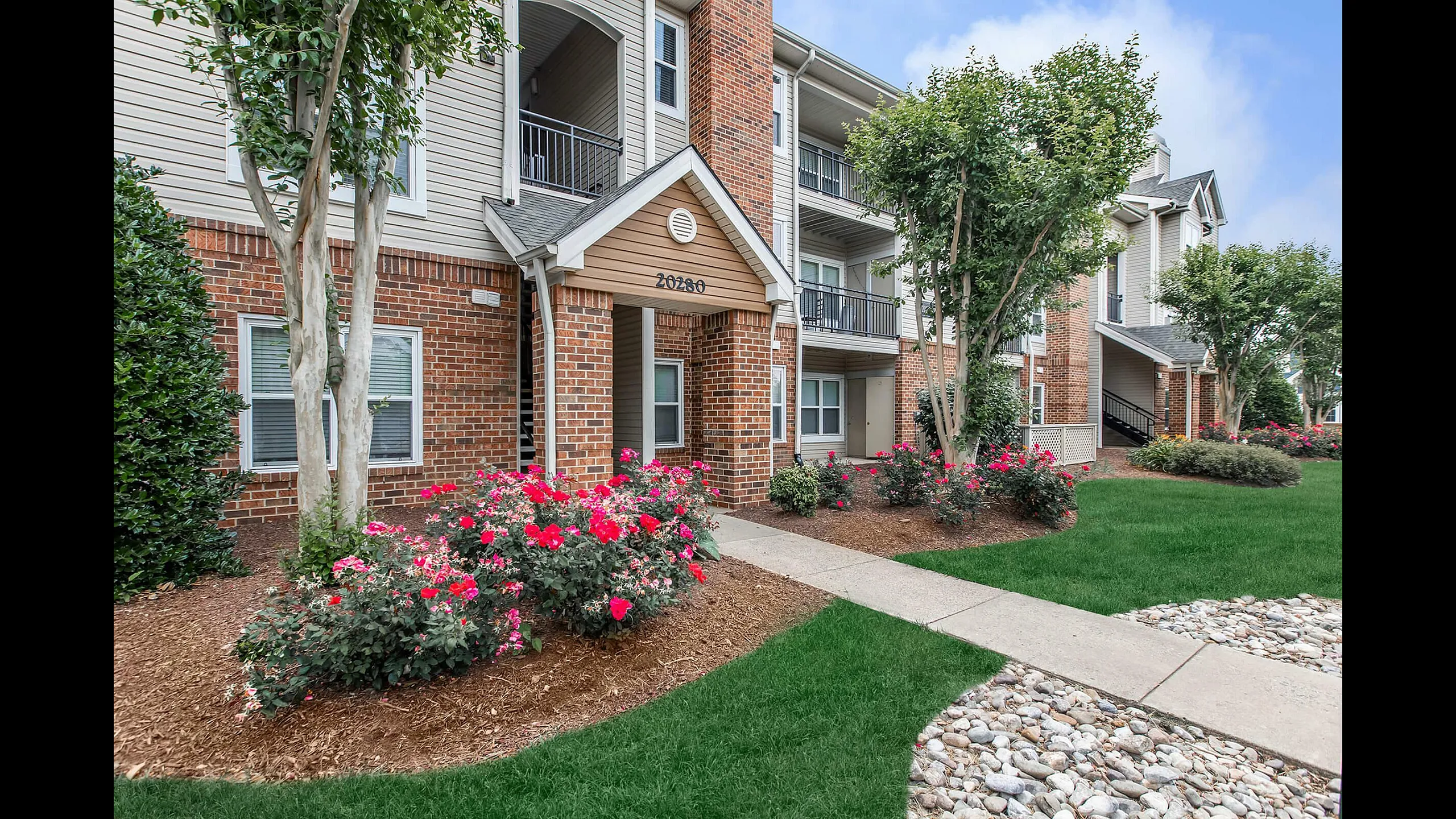 The Brixton at Loudoun Apartments Building Exterior with Private Entrances and Patios and Balconies