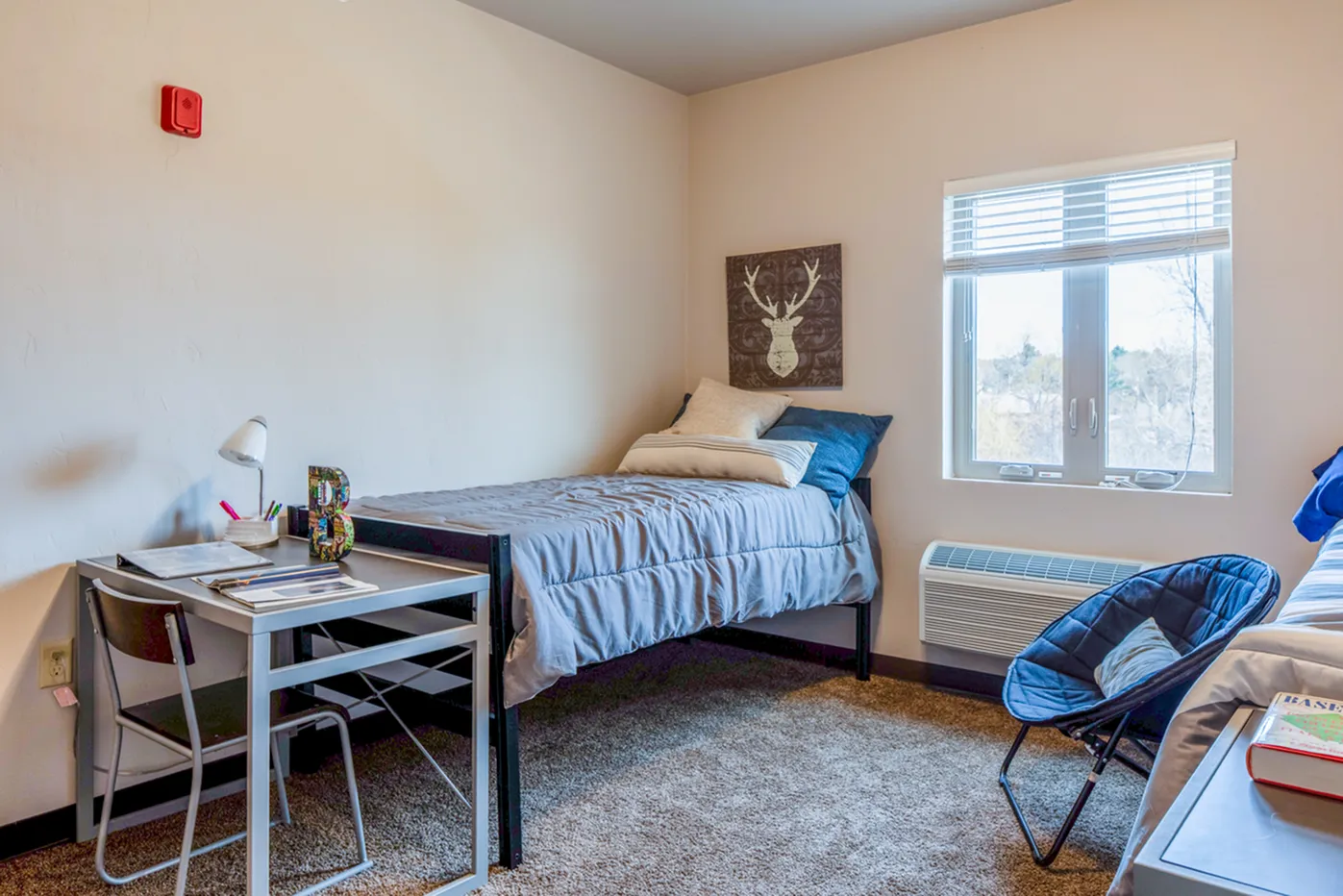Furnished bedroom at Timberwolf Suites Student Living