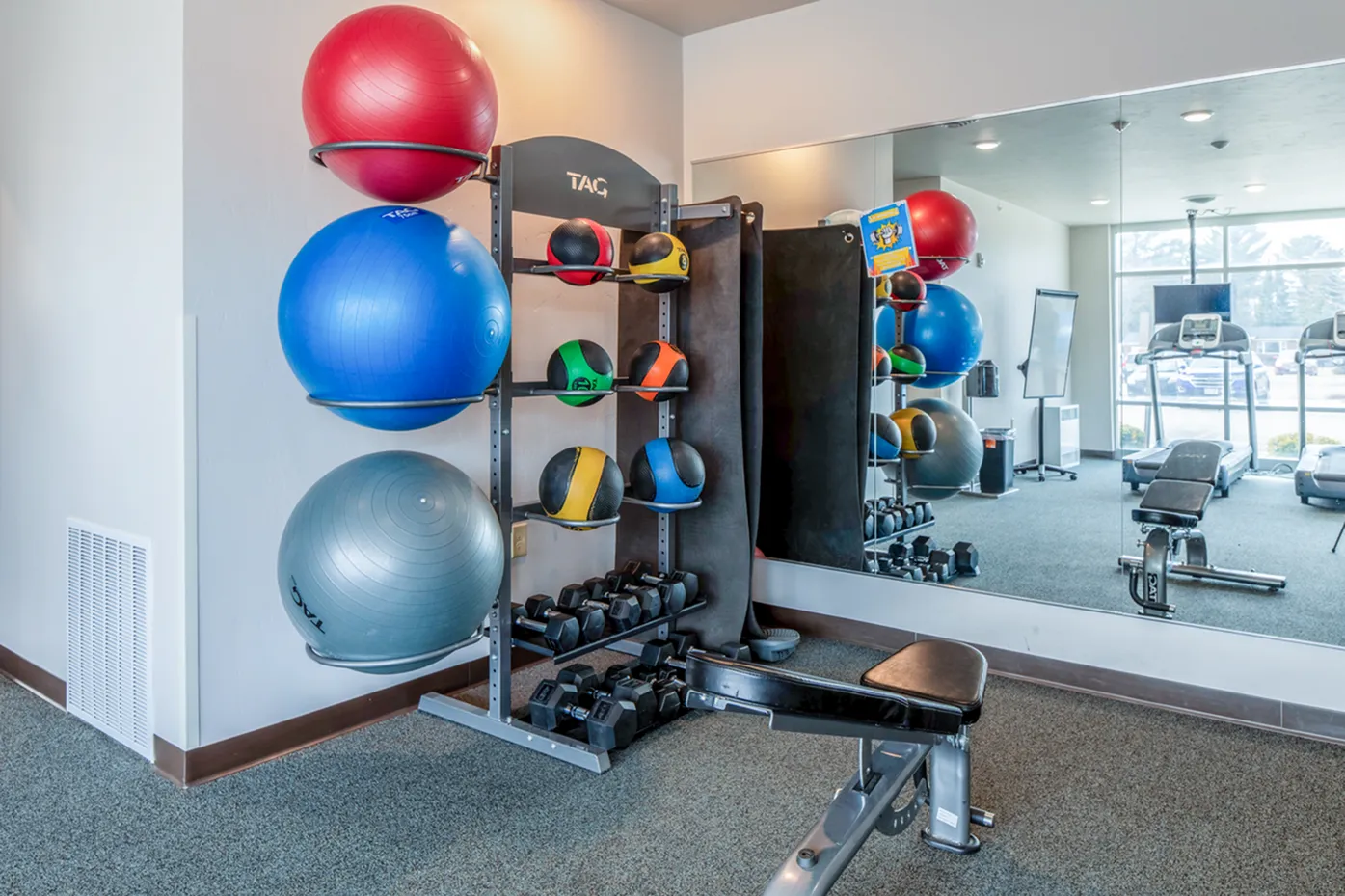 Fitness room equipment provided at Timberwolf Suites Student Living