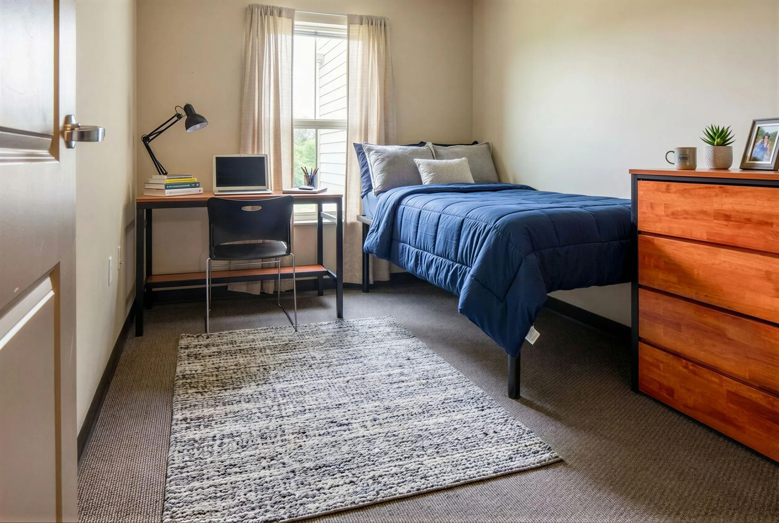 Cozy bedroom with a modern desk and comfortable bed, perfect for a study retreat, featuring natural light and stylish décor.