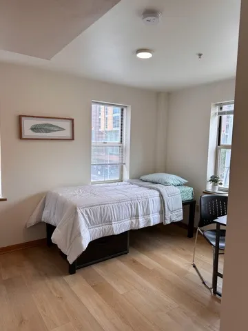 Bedroom-Model Unit fully furnished bedroom including twin bed and desk and chair. spacious rooms with plenty of natural light